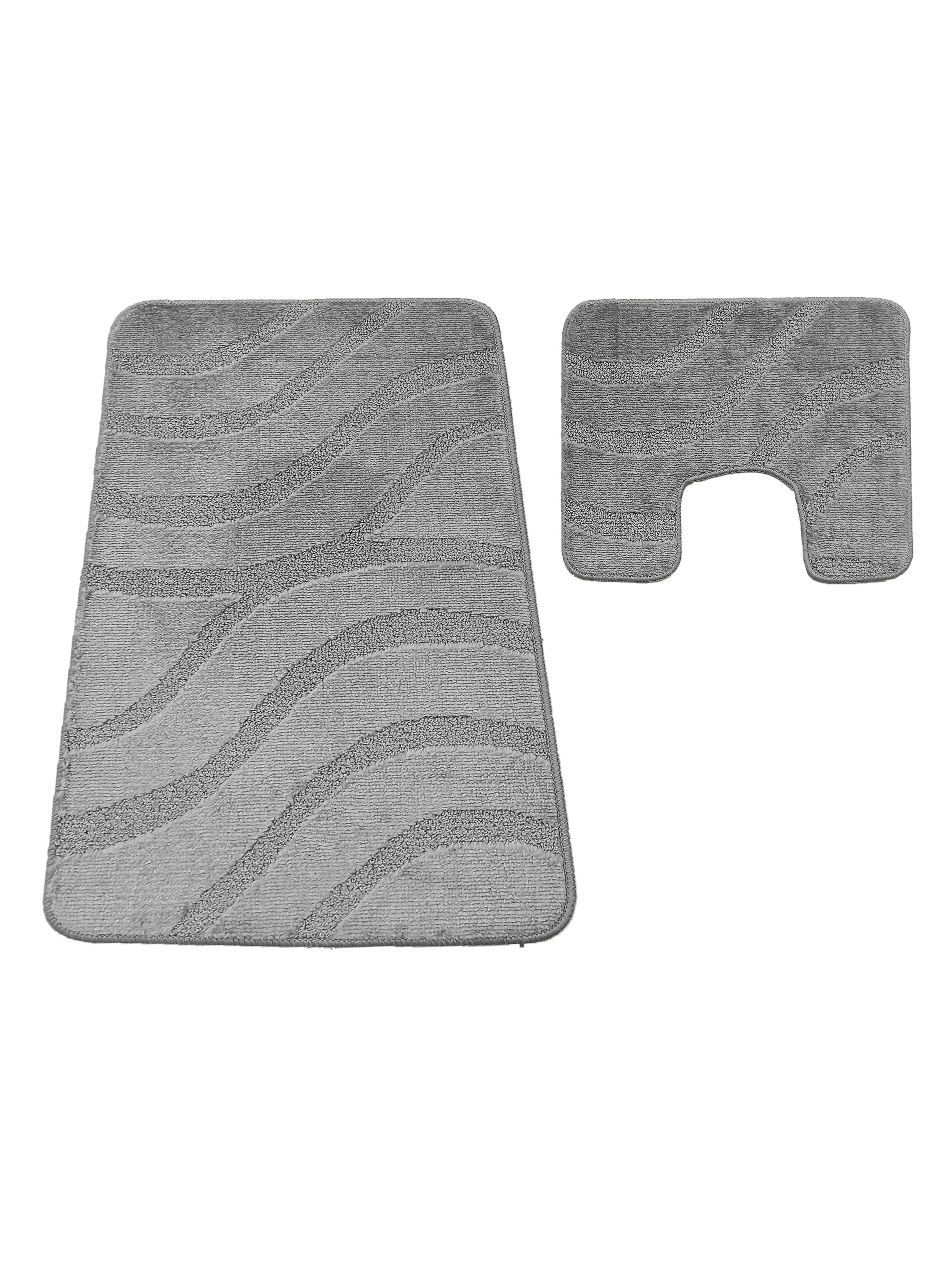 Deux tapis gris avec des motifs de vagues en relief, un rectangulaire et un en forme de U