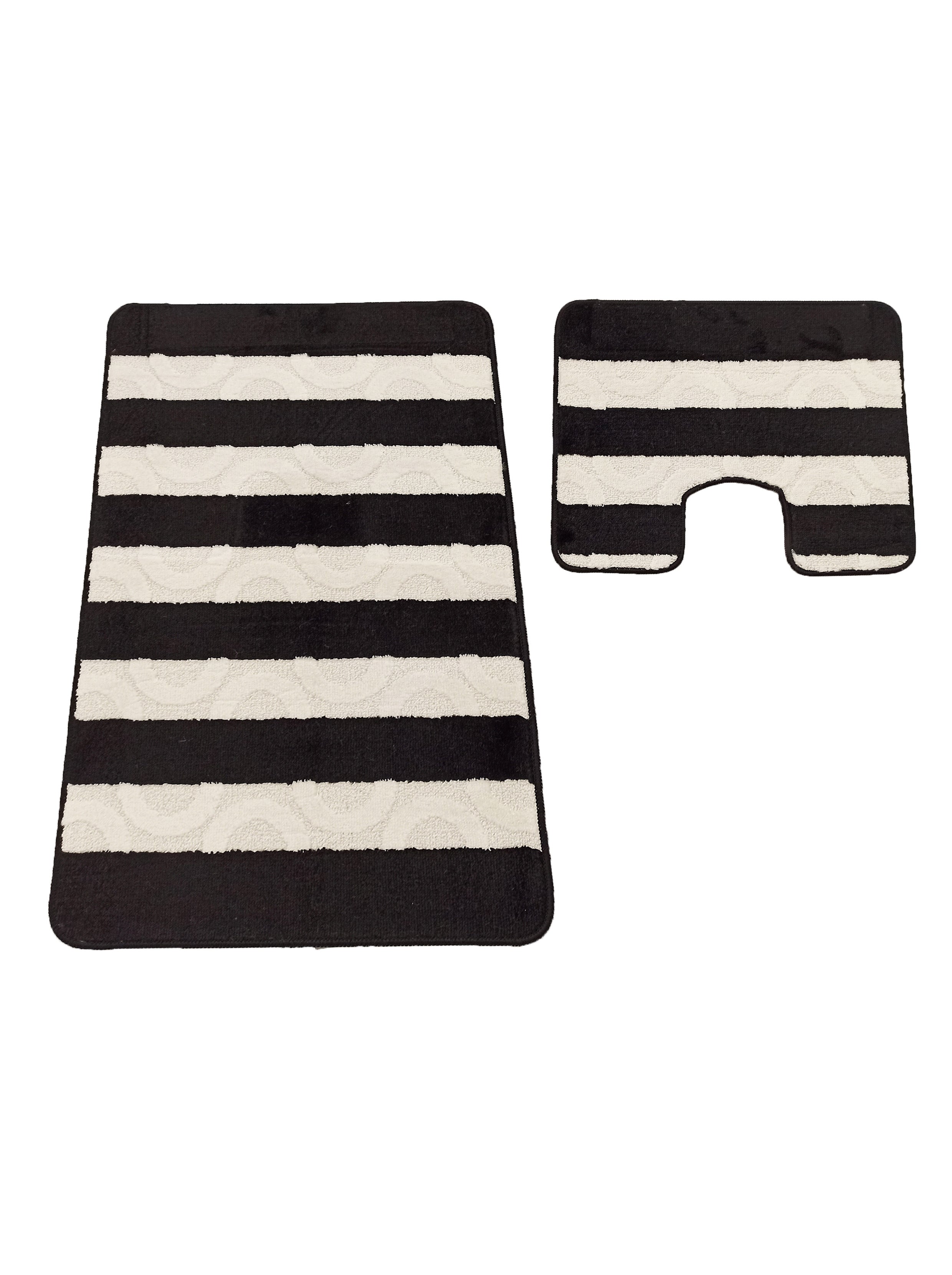 Lot de deux tapis textiles, l'un rectangulaire l'autre en forme de U, à larges rayures noires et crème, les bandes claires ayant des motifs en relief d'arcs concentriques