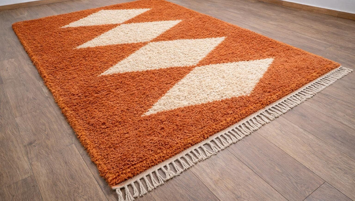 Tafraout diamond-pattern Berber rug in terracotta, on the floor, seen from the side, hand-knotted in Morocco