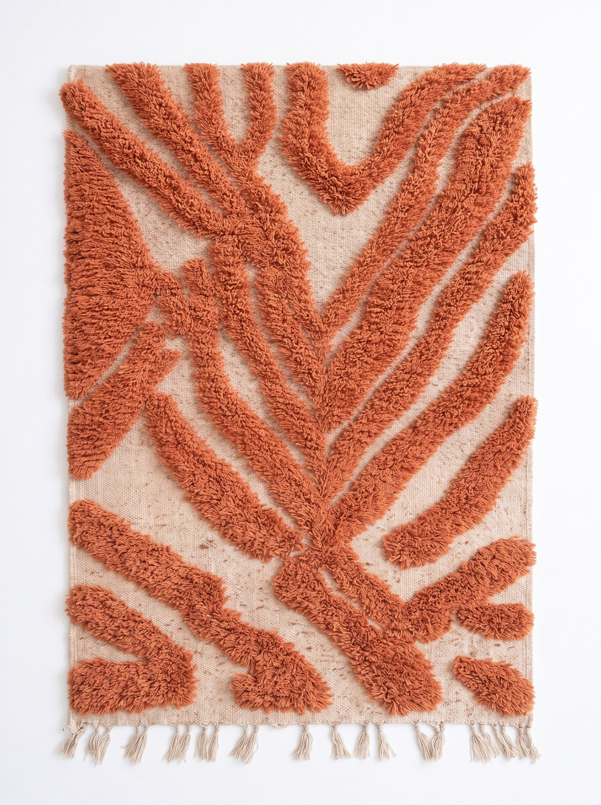 Anmira patterned Berber rug in terracotta, laid flat, short-woven ecru base, large terracotta palm leaf