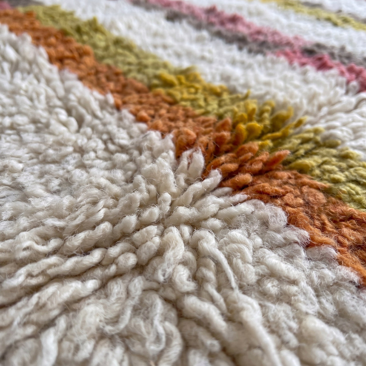 Close-up of a motif on the Fenzar Berber rug, long-pile field on an ecru ground