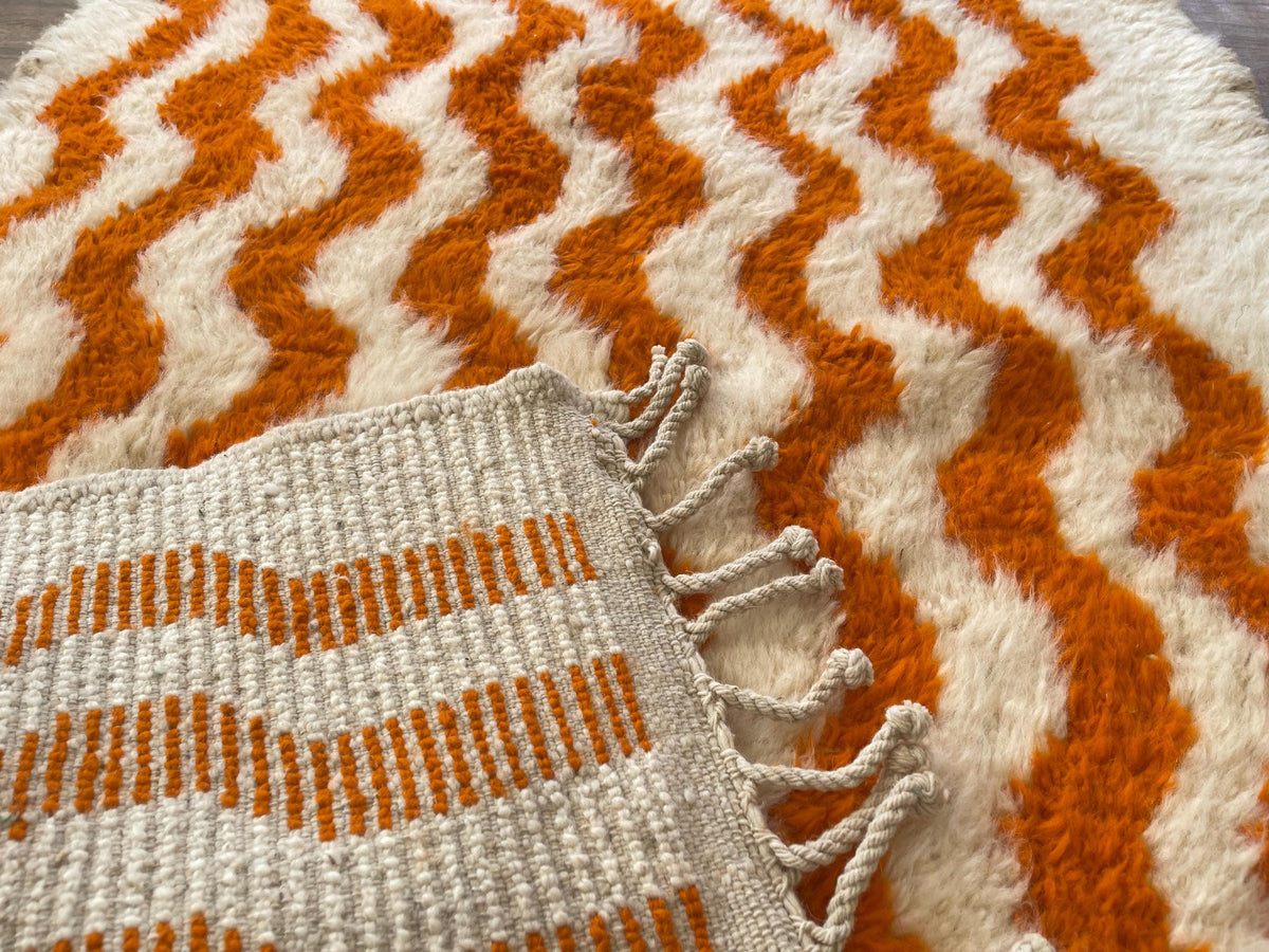 Close-up of the back of the Imider Berber rug, knots visible on the cotton warp, no backing