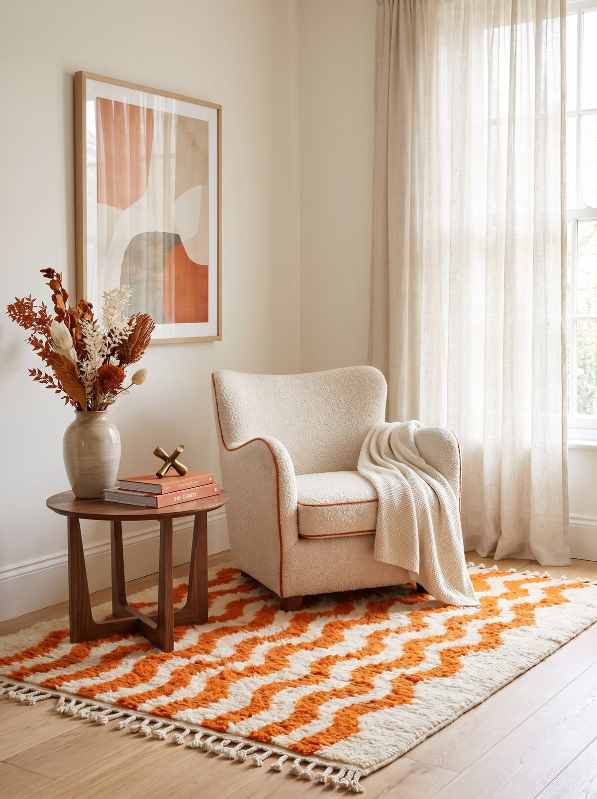 Imider striped Berber rug in orange and white, in a reading nook, hand-knotted in Morocco