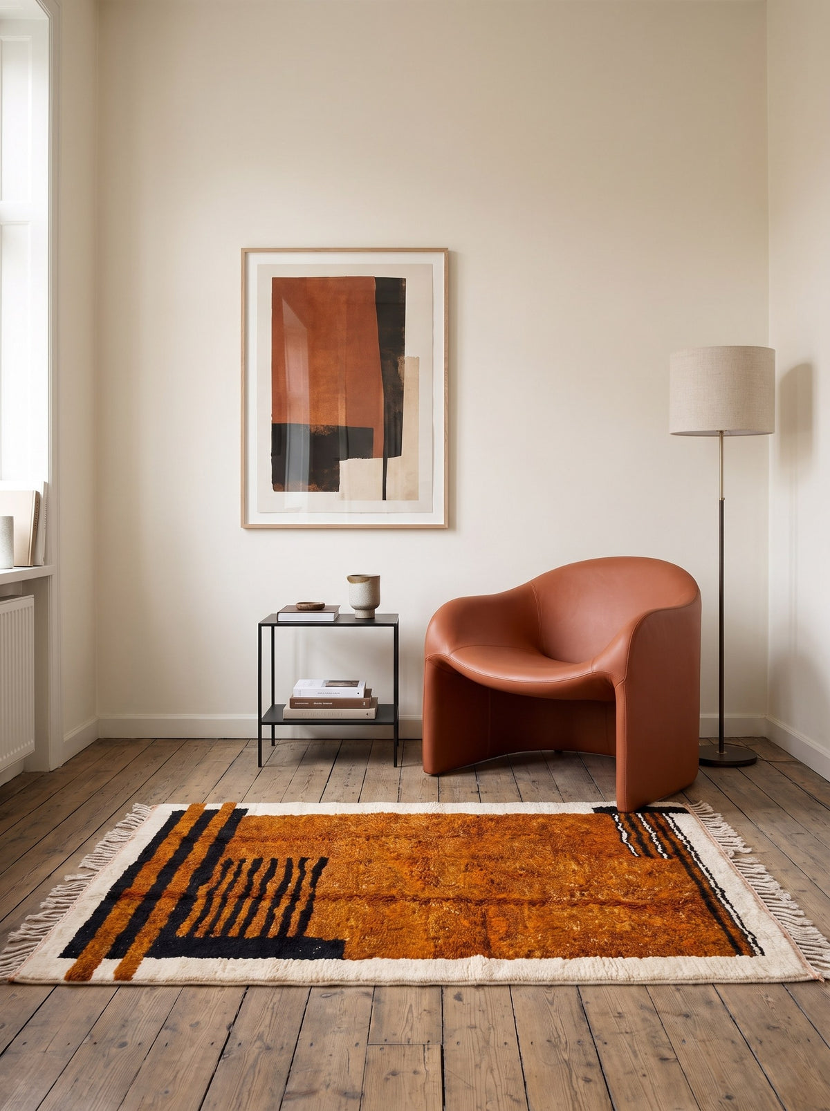 Boudinar striped Berber rug in rust and black in a reading nook, hand-knotted in Morocco