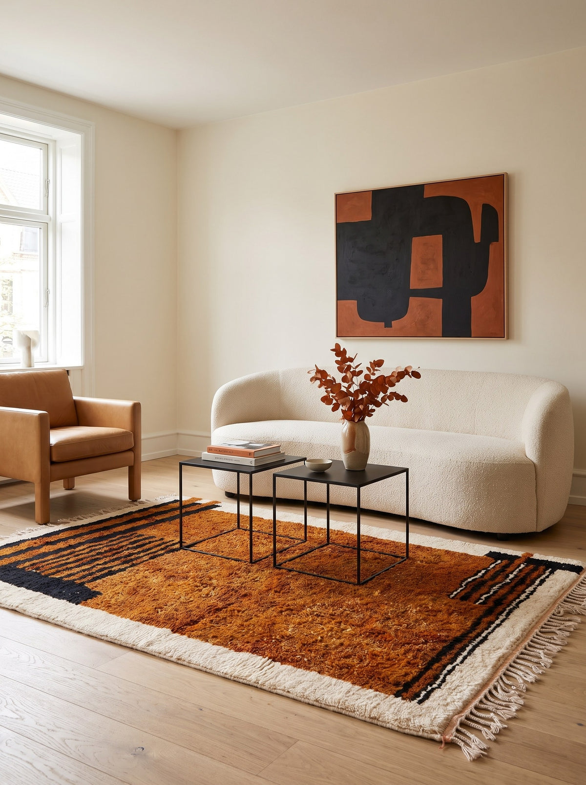 Boudinar striped Berber rug in rust and black in a living room, hand-knotted in Morocco