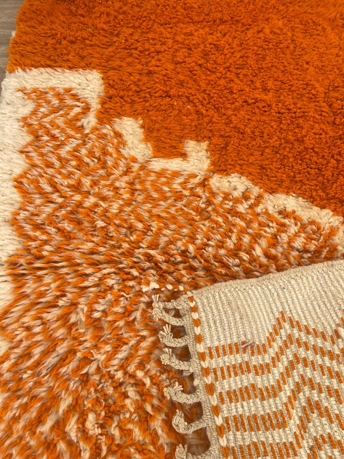 Close-up of the back of the Azghal Berber rug, knots visible on the cotton warp, no backing