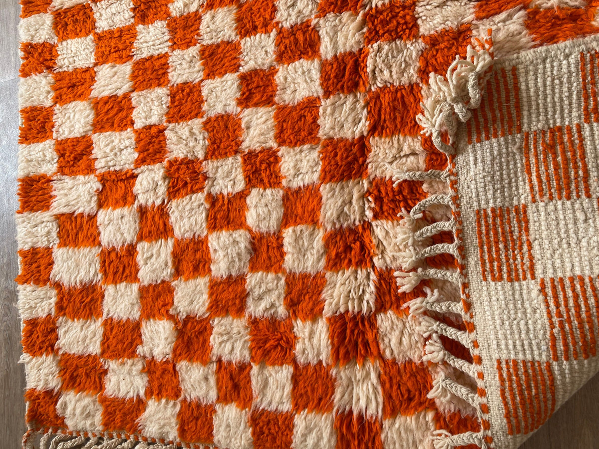 Close-up of the back of the Ouzina Berber rug, knots visible on the cotton warp, no backing