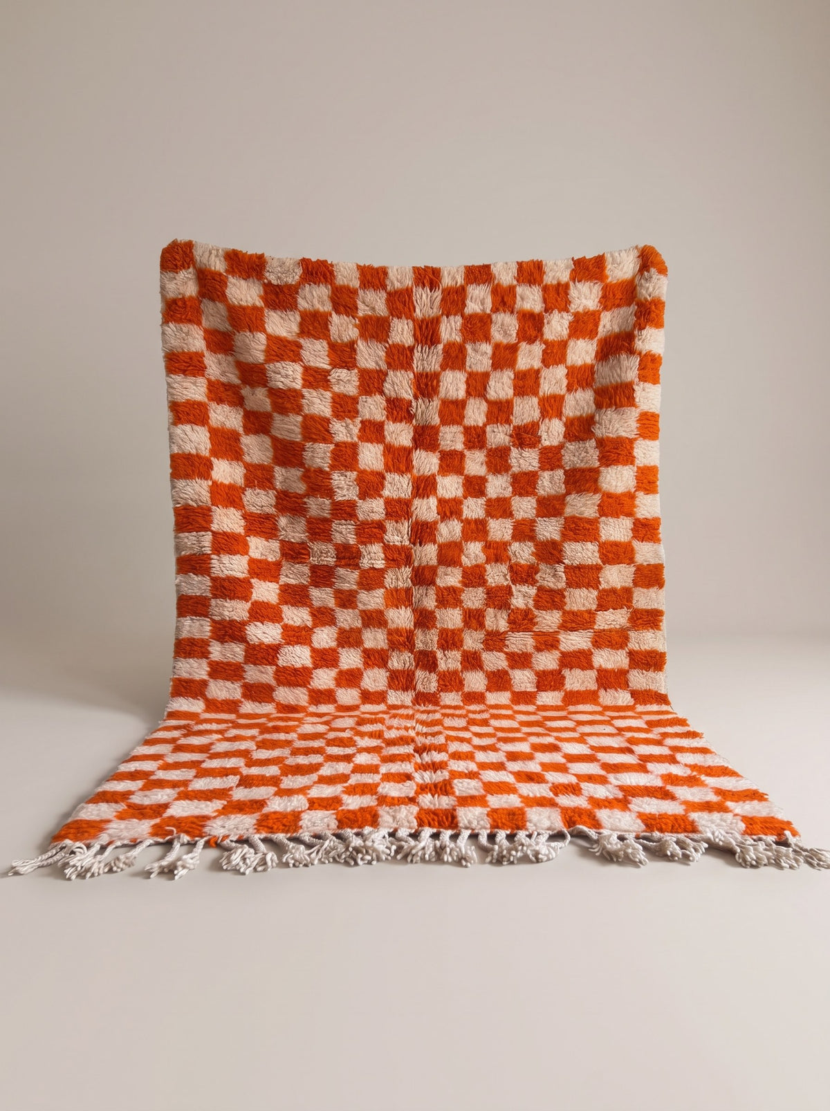 Ouzina orange checkerboard Berber rug, hanging, one of a kind, hand-knotted in Morocco
