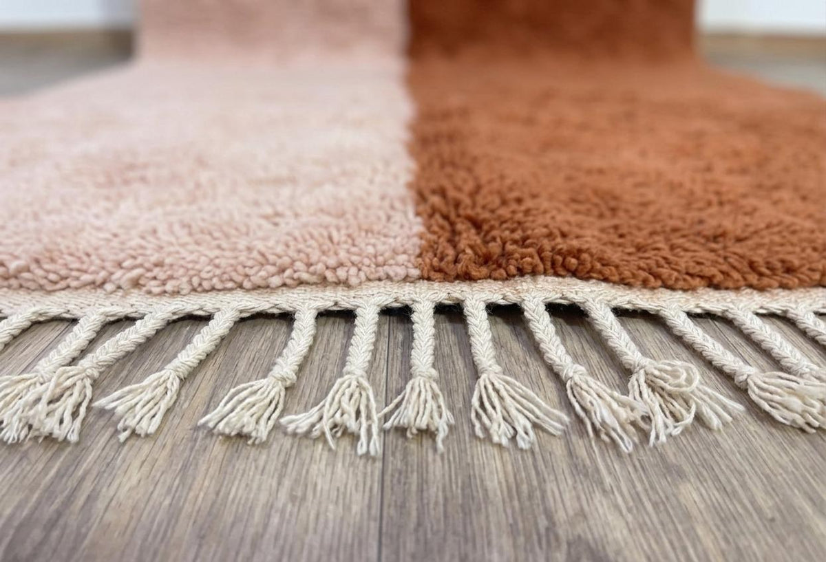 Close-up of the fringes on the Tamzoun Berber rug, where the fringes attach and the last row of knots