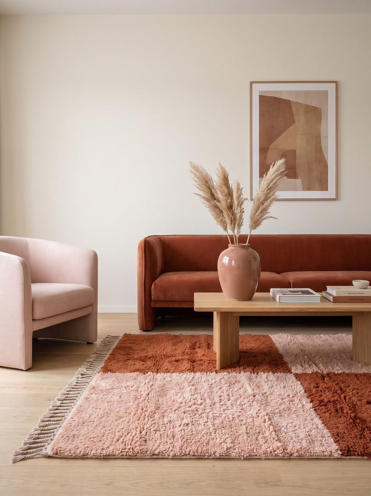 Pink and terracotta checkerboard Tamzoun Berber rug in another living room, hand-knotted in Morocco