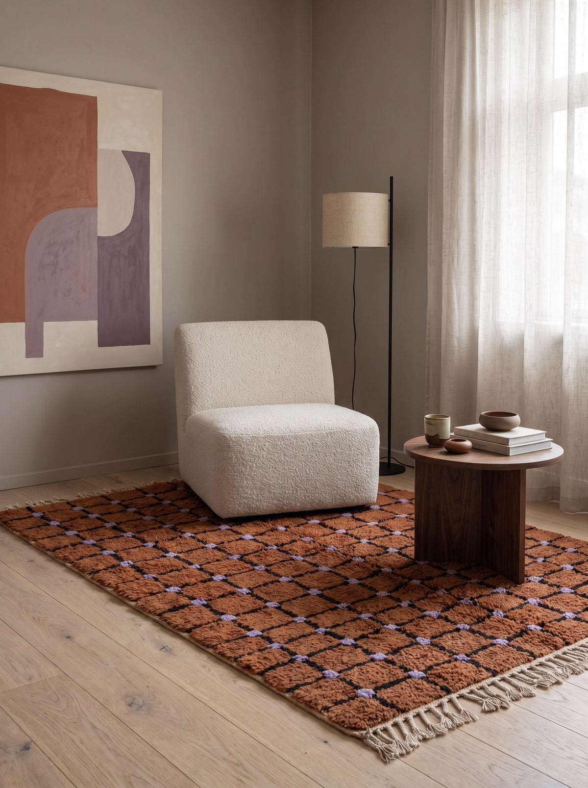 Terracotta checkerboard Tirfalt Berber rug in a reading nook, hand-knotted in Morocco