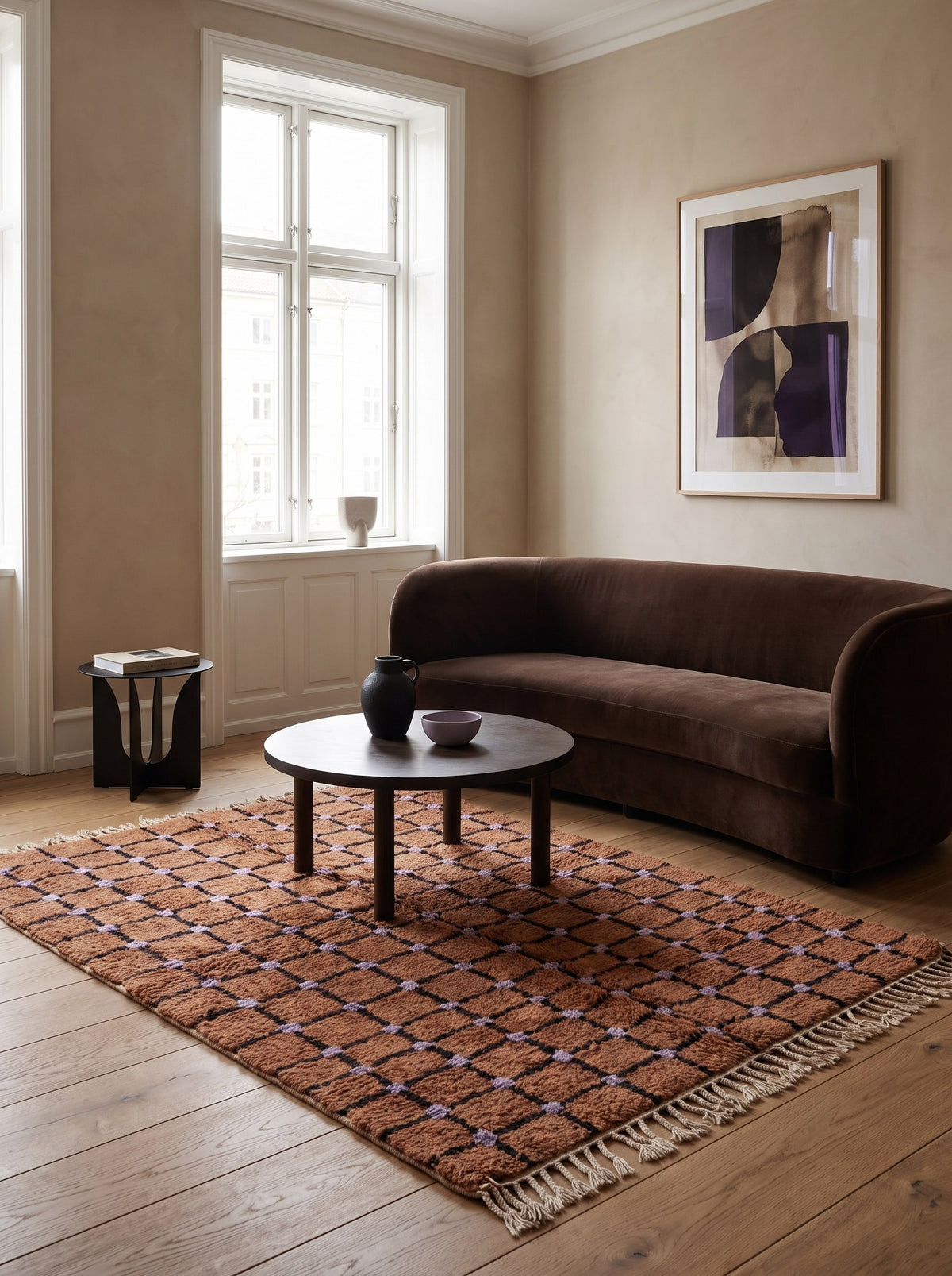 Terracotta checkerboard Tirfalt Berber rug in a living room, hand-knotted in Morocco
