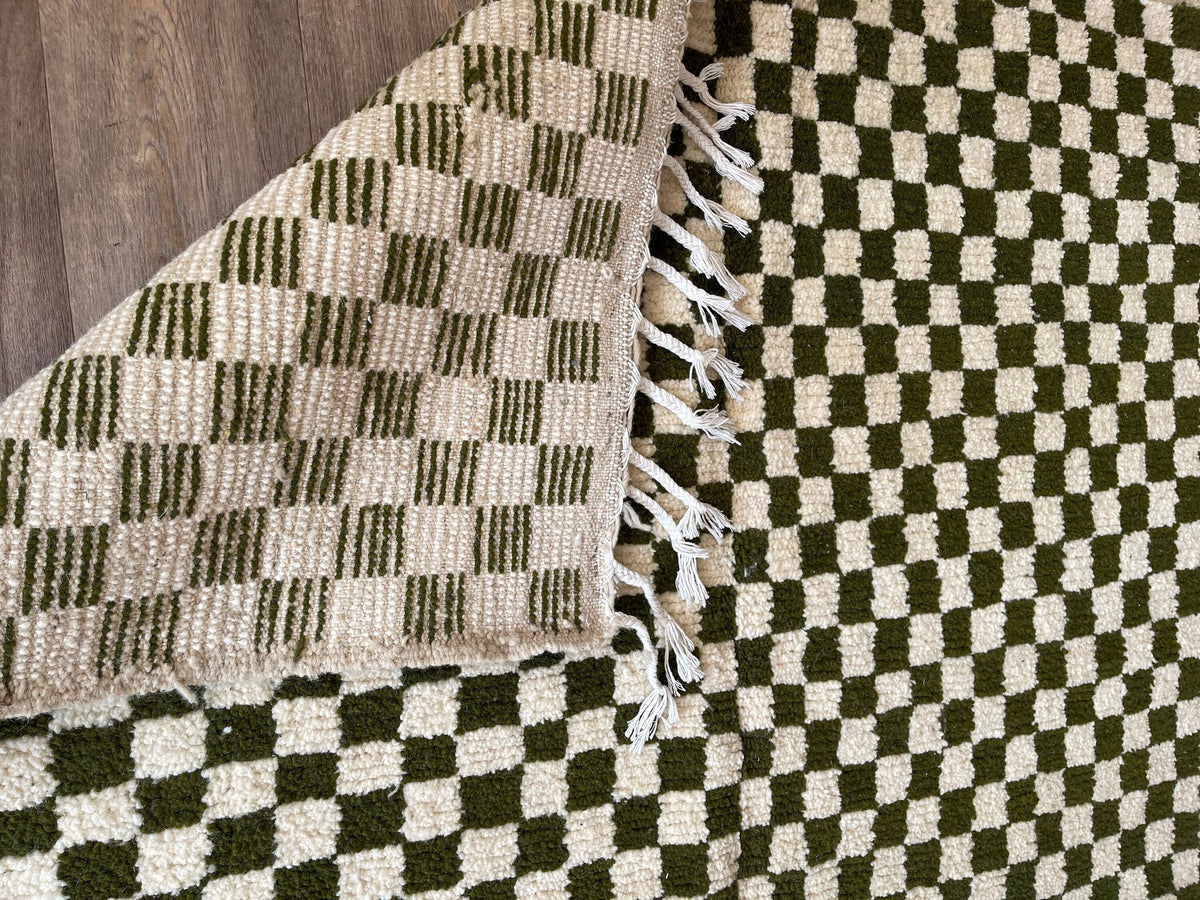 Gros plan sur l'envers du tapis berbère Tagounite, nœuds visibles sur la chaîne de coton, sans dossier