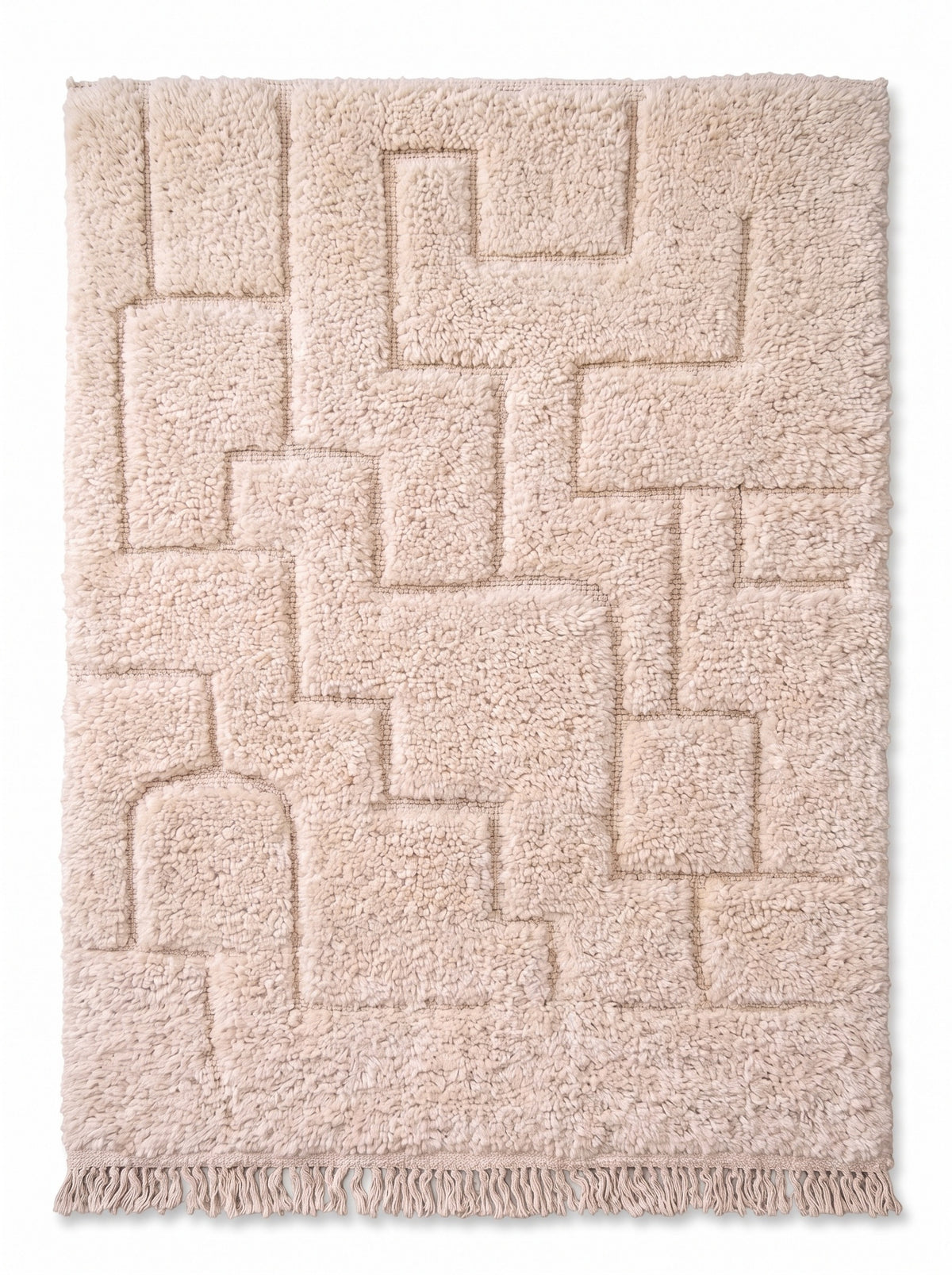 Tapis berbère en relief ivoire Lixus vu à plat, laine ivoire dense, franges écrues nouées en bas seulement