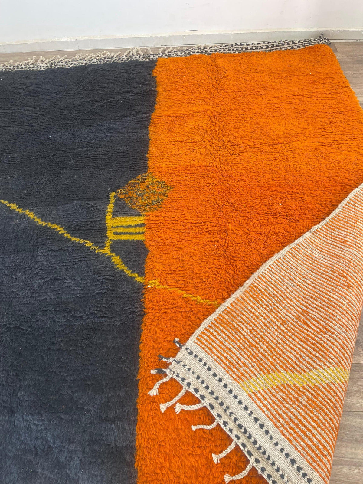 Close-up of the back of the Fezouata Berber rug, knots visible on the cotton warp, no backing