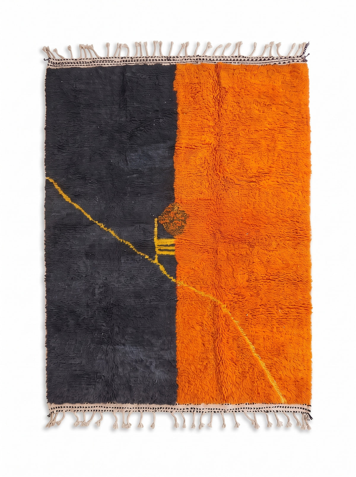 Fezouata graphic Berber rug in charcoal and orange, laid flat, two equal halves, charcoal on the left and bright orange