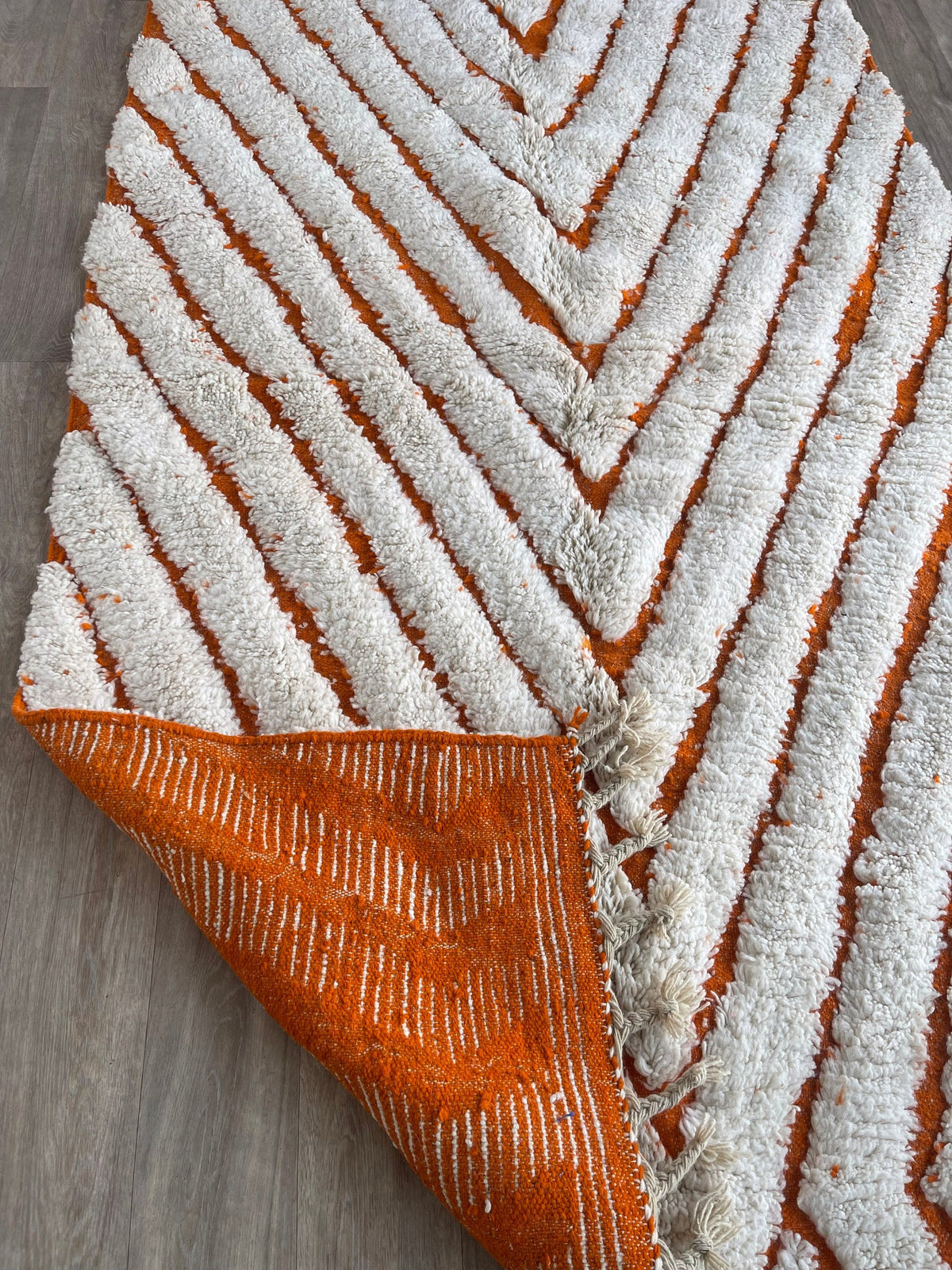 Close-up of the back of the Igdat Berber rug, knots visible on the cotton warp, no backing
