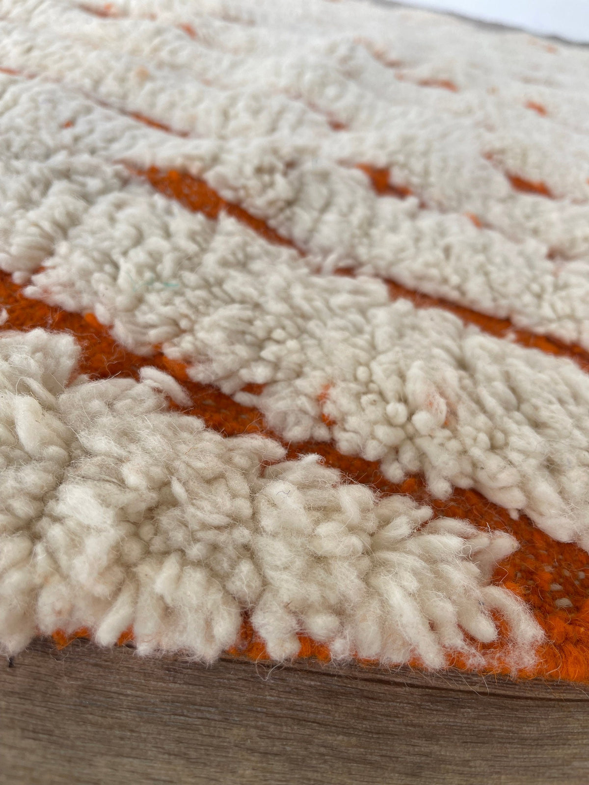 Close-up of the wool of the Igdat Berber rug, tight knots and the line of the pattern up close