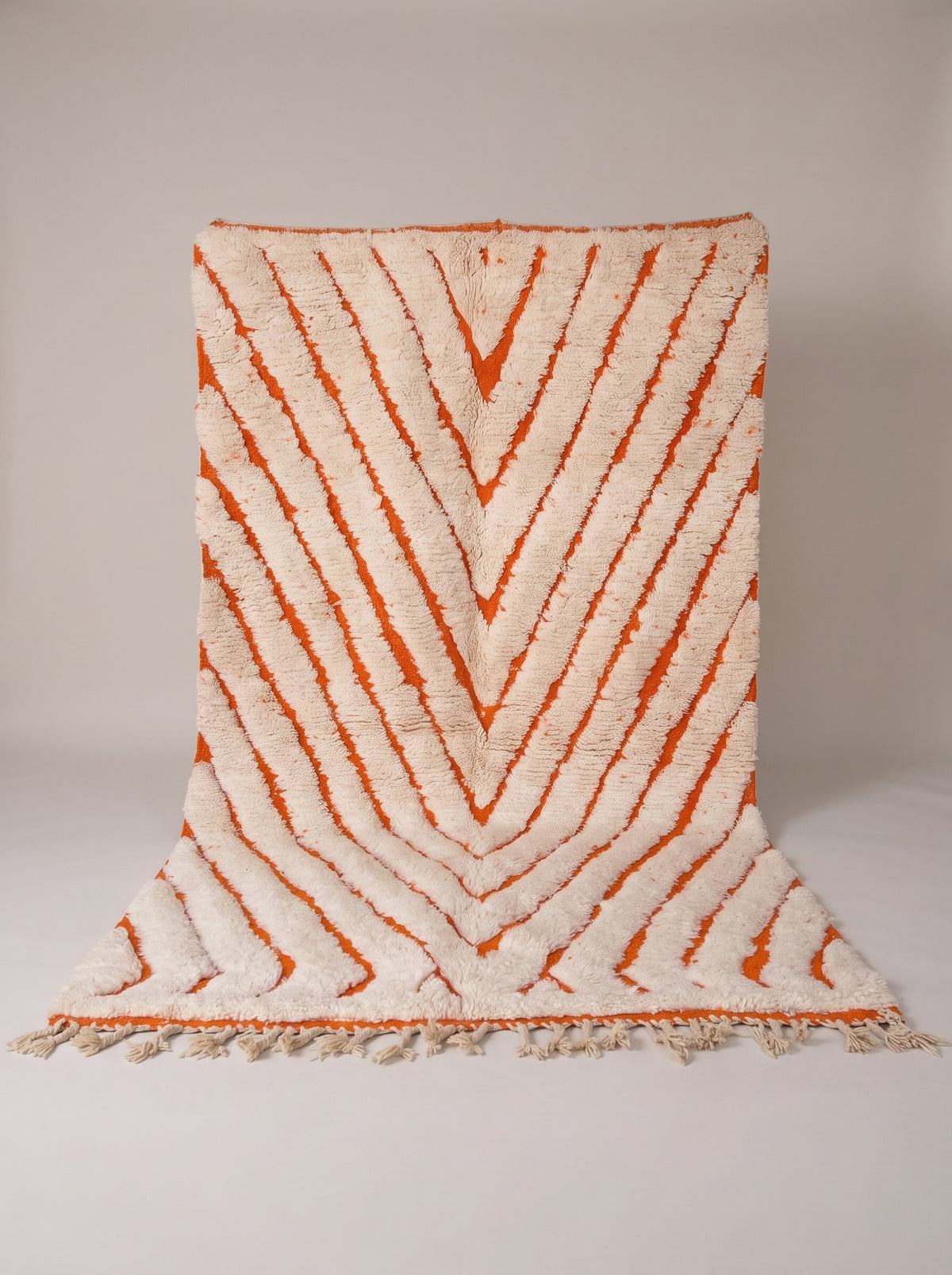 Igdat graphic Berber rug in white and orange, hanging, one of a kind, hand-knotted in Morocco