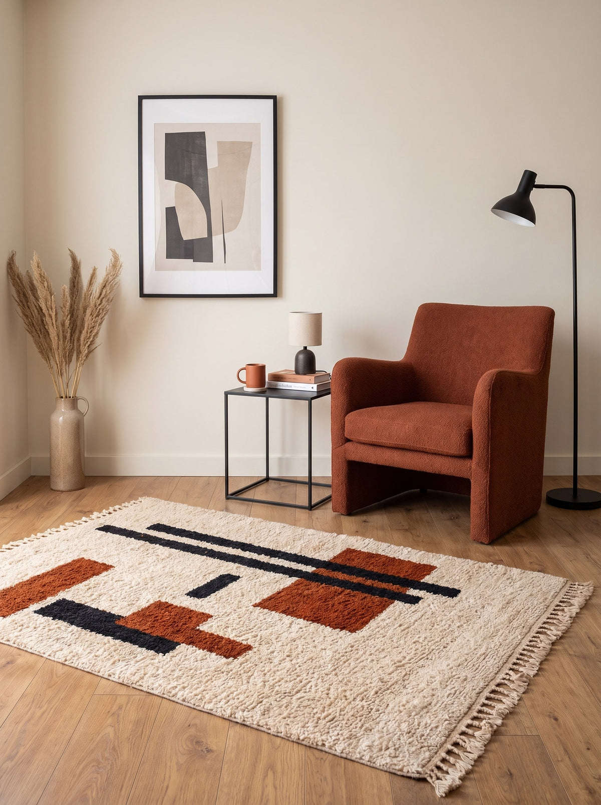 Meskala graphic Berber rug in white and terracotta, in a reading nook, hand-knotted in Morocco