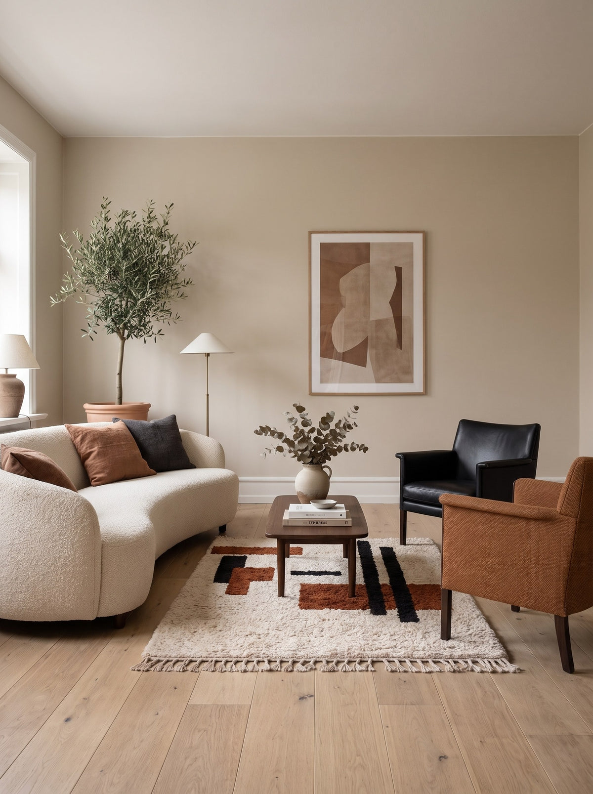 Meskala graphic Berber rug in white and terracotta, in another living room, hand-knotted in Morocco