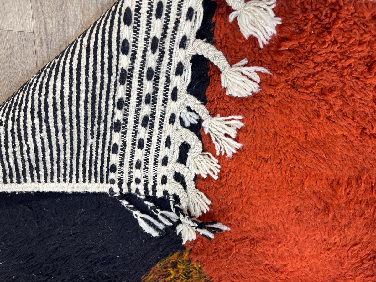 Close-up of the back of the Guelmim Berber rug, knots visible on the cotton warp, no backing
