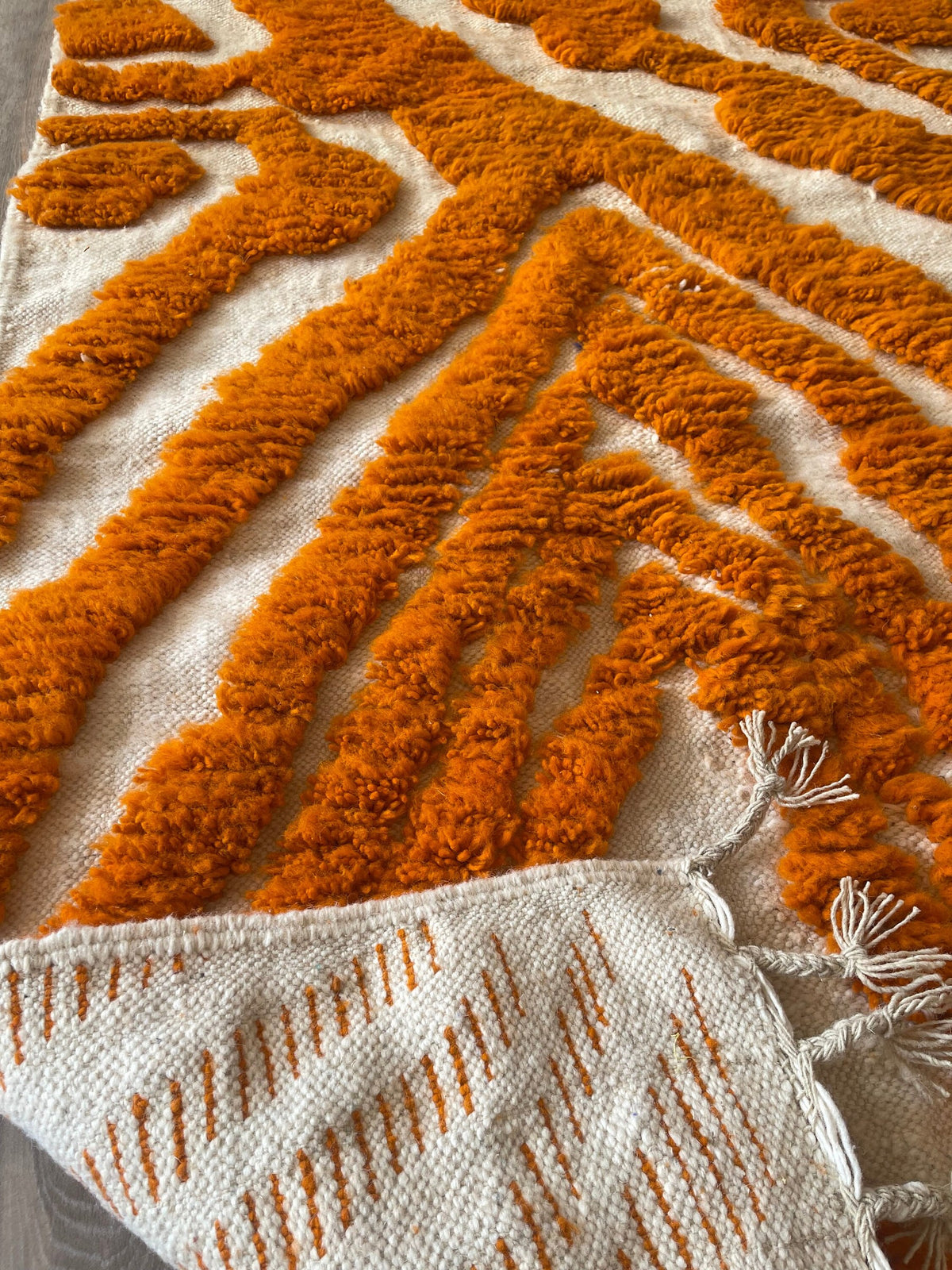 Close-up of the back of the Tazemurt Berber rug, knots visible on the cotton warp, no backing