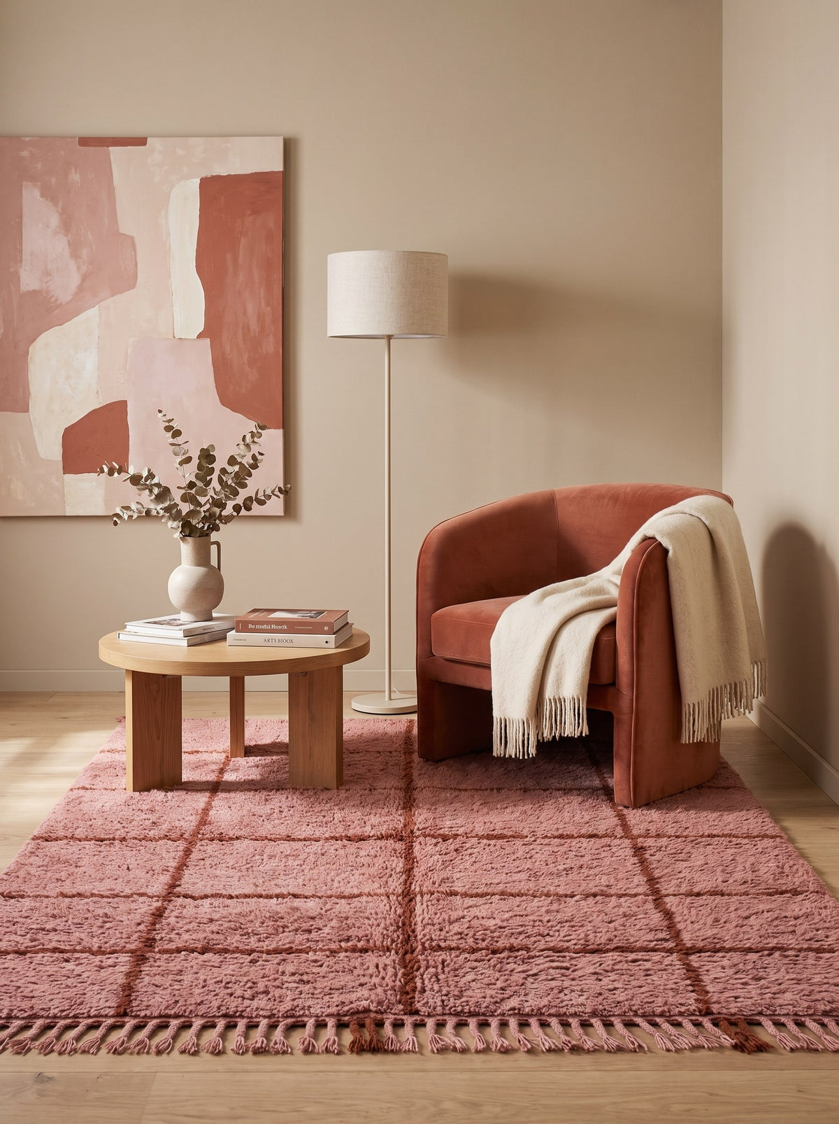 Imassine graphic Berber rug in pink and rust, in a reading nook, hand-knotted in Morocco