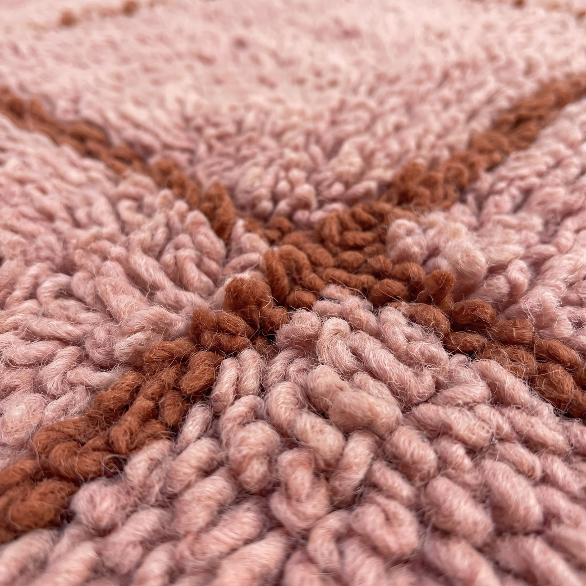 Close-up of a motif on the Imassine Berber rug, powder pink ground with a long, dense pile