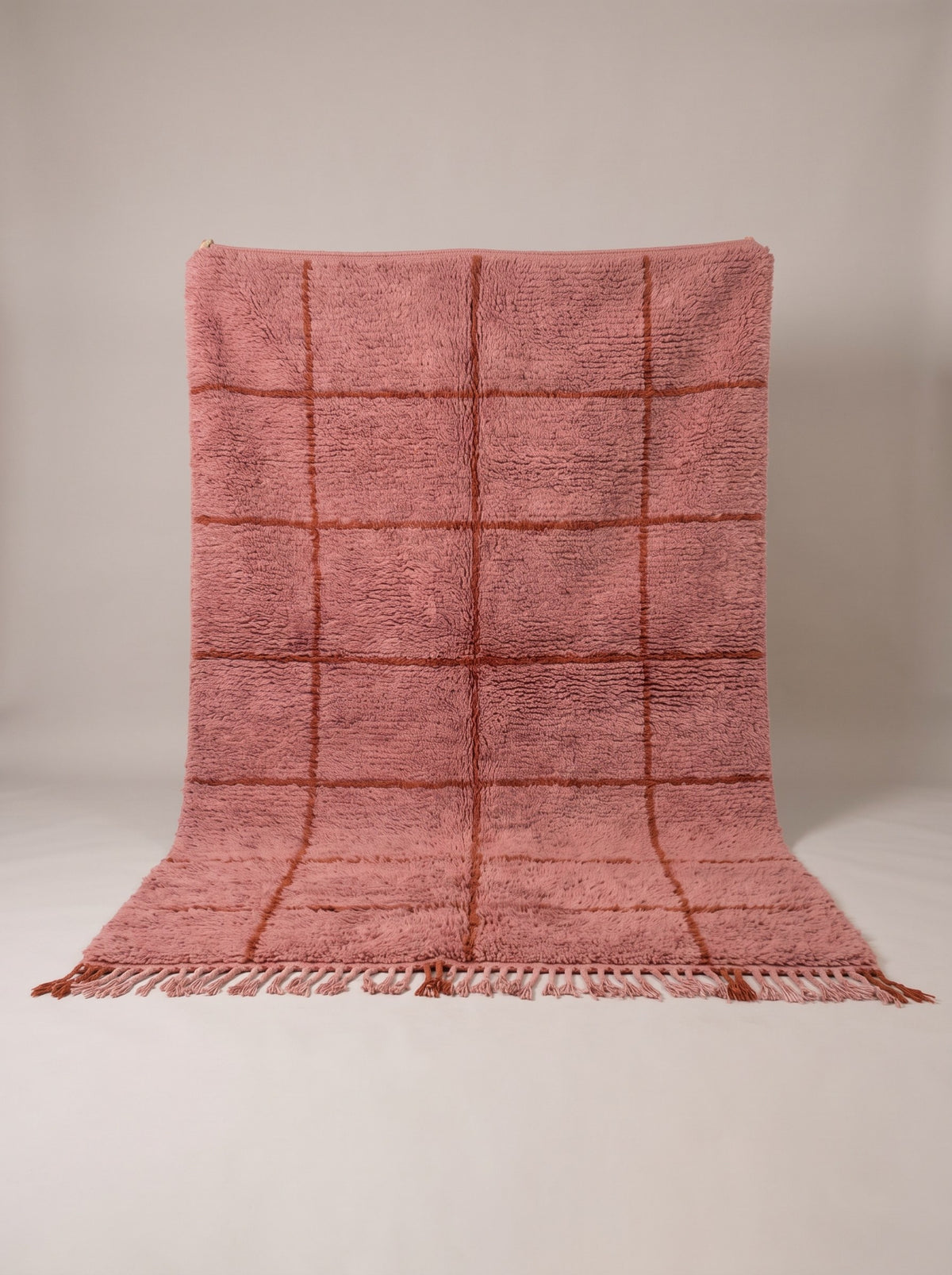 Imassine graphic Berber rug in pink and rust, hanging, one of a kind, hand-knotted in Morocco