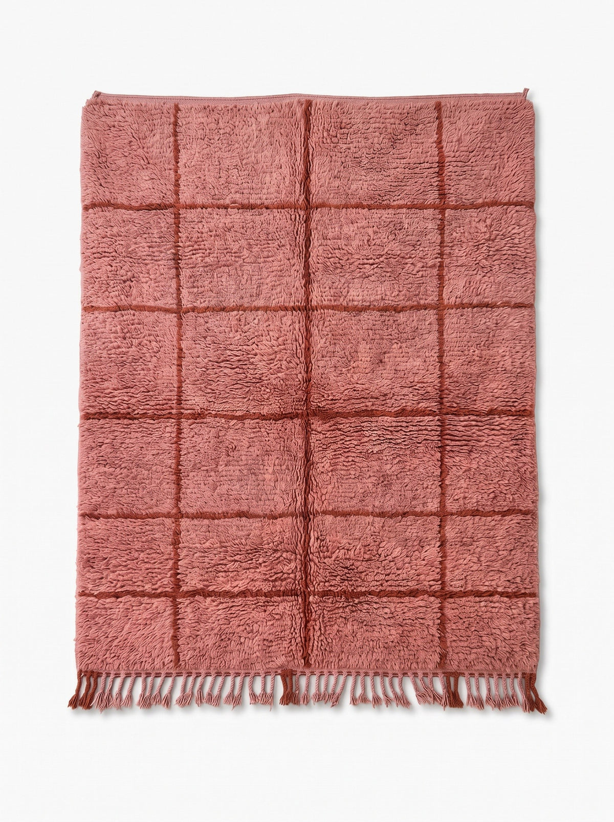 Imassine graphic Berber rug in pink and rust, laid flat, dense long-pile powder pink ground