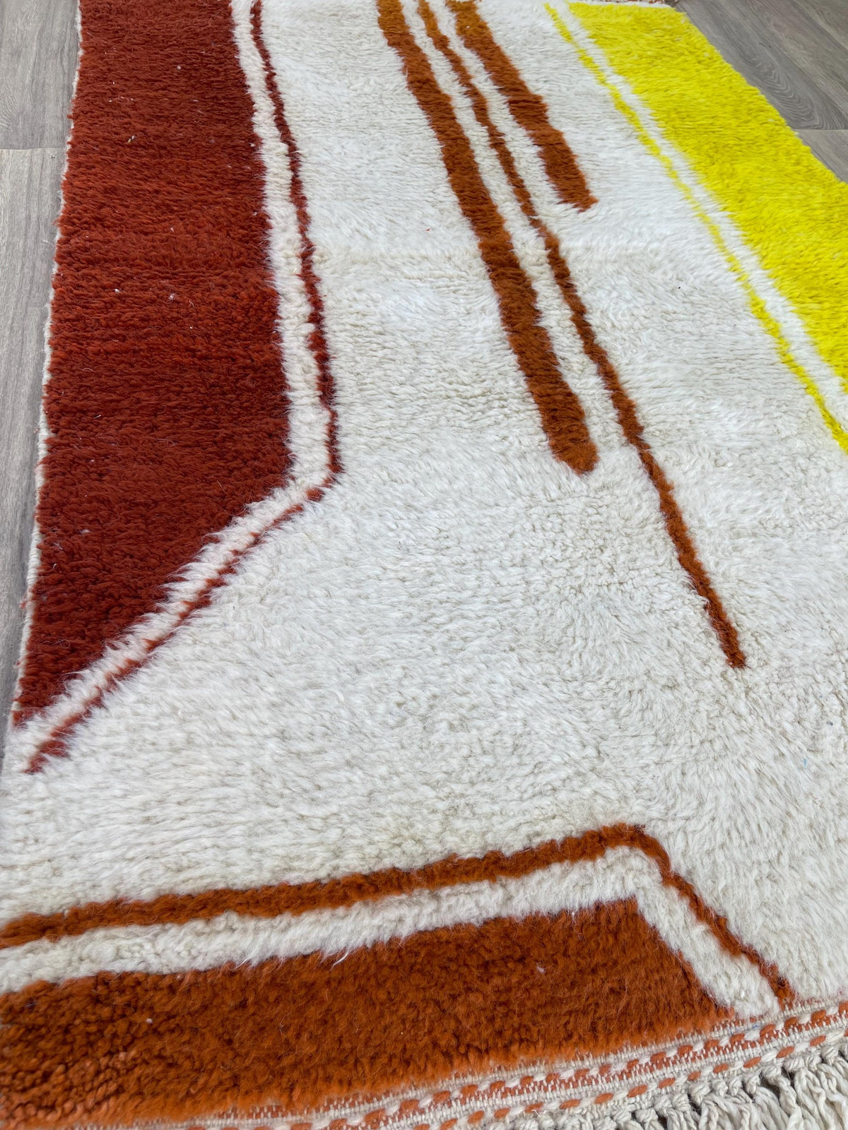 Close-up of a detail of the Haouza Berber rug, irregular lines of the handmade pattern