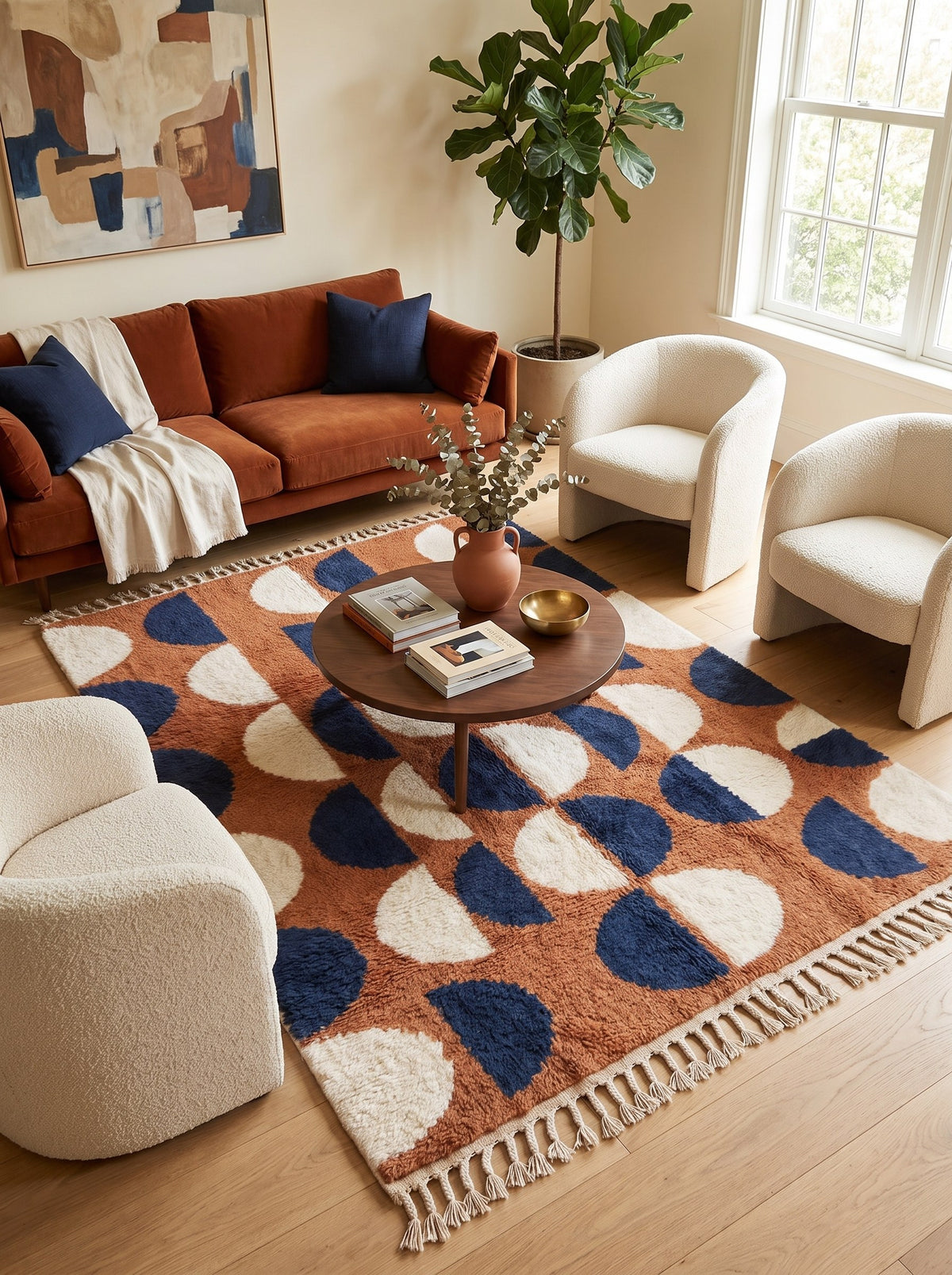 Ziri graphic Berber rug in terracotta and midnight blue, in a living room, hand-knotted in Morocco