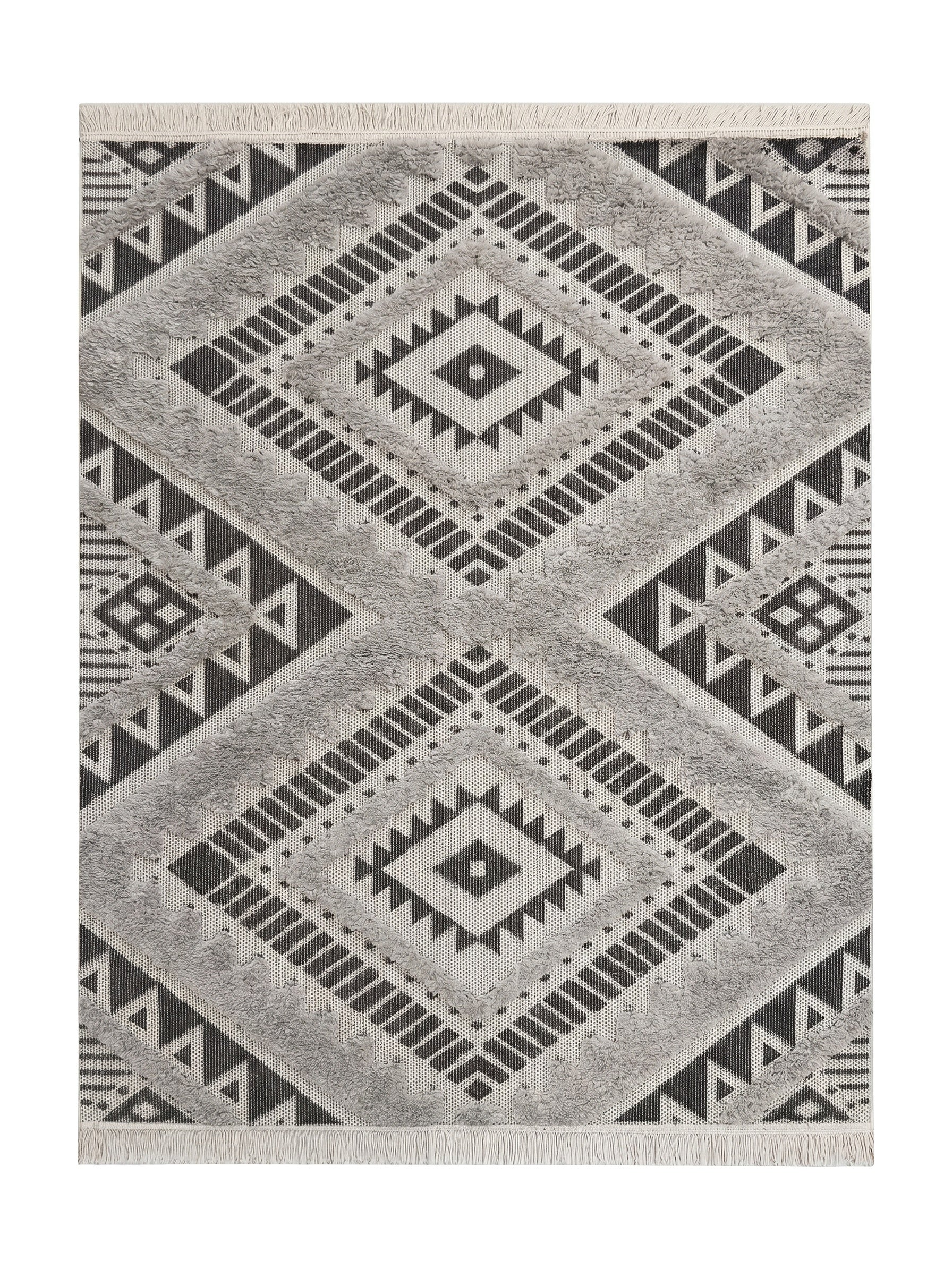 Tapis blanc, noir et gris à motifs géométriques ethniques avec des zones touffues et des franges aux extrémités