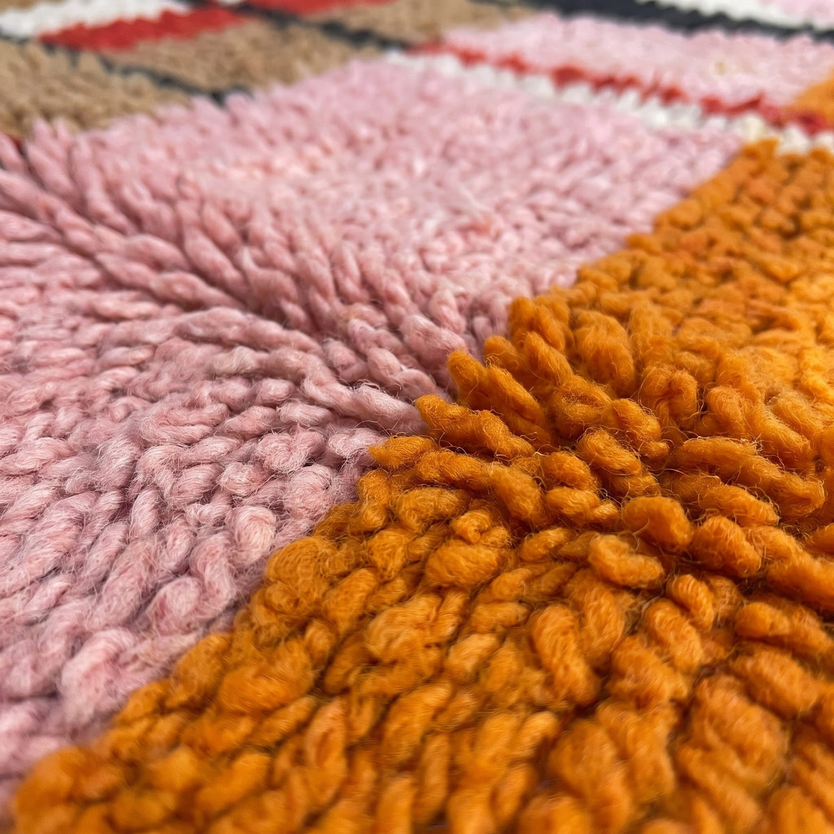 Close-up of a motif on the Tifuraz Berber rug, light brown central field with black lattice