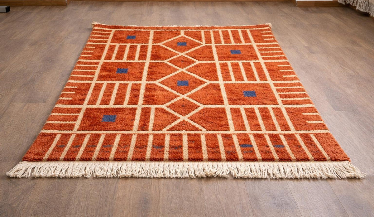 Tiznit Berber rug, Boujad style, in terracotta, on the floor, seen from the side at an angle, hand-knotted in Morocco