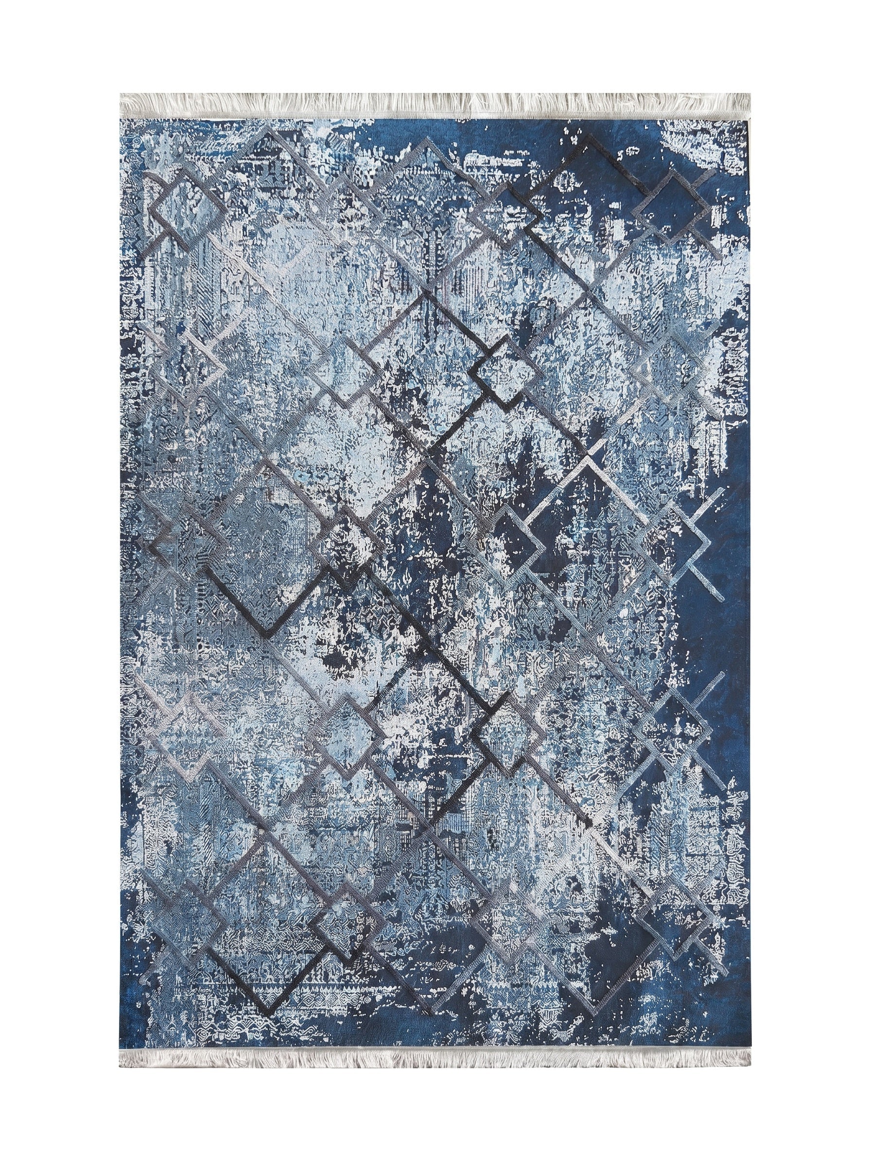 Tapis textile bleu et blanc à motifs abstraits et délavés, avec un réseau de losanges géométriques en relief et des franges claires