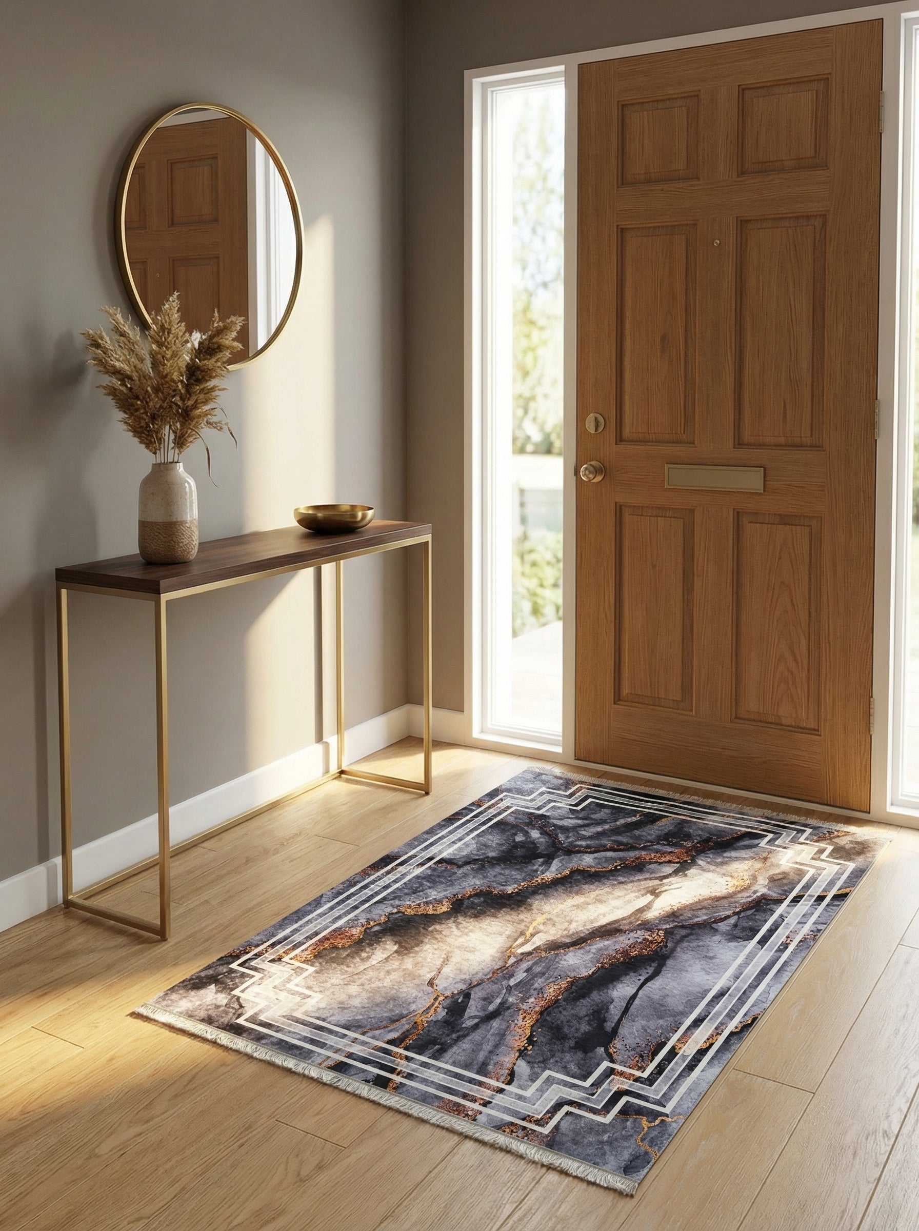Tapis rectangulaire à motif marbre anthracite, beige et or, encadré de lignes géométriques blanches, dans une entrée