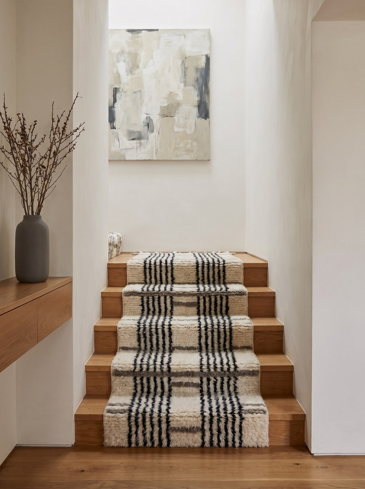 Aknoul striped Berber stair runner in white and black, on a staircase, hand-knotted in Morocco