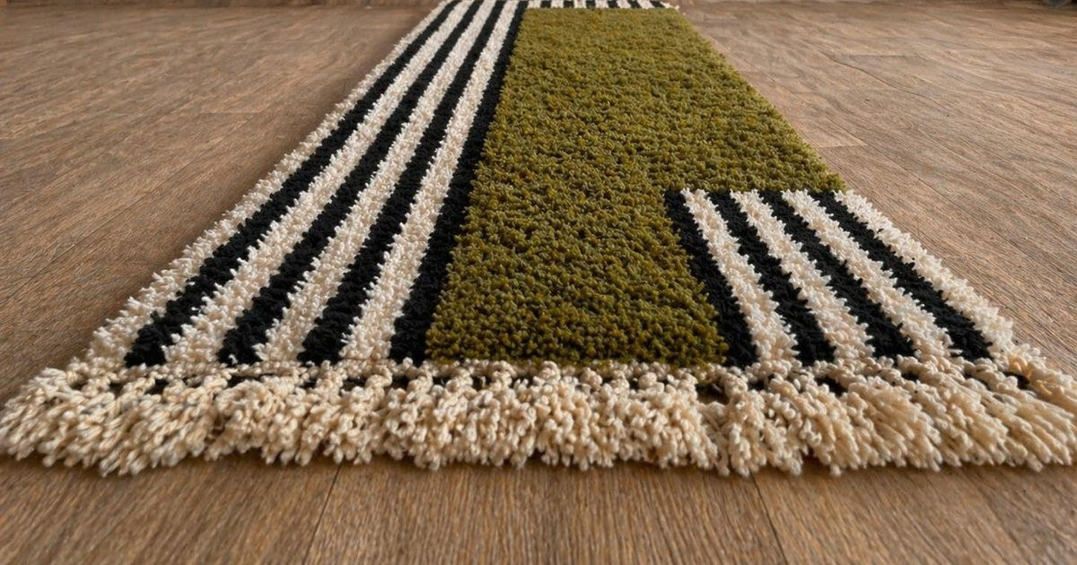 Tanuwar Berber stair runner, striped, in olive green, on the floor, seen from the side, hand-knotted in Morocco