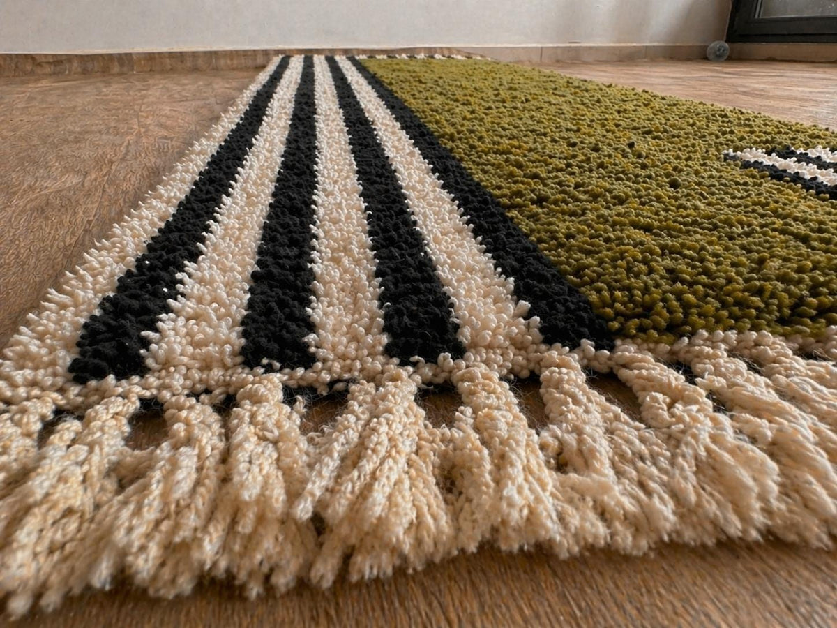 Close-up of the fringes on the Tanuwar Berber stair runner, ecru, knotted by hand