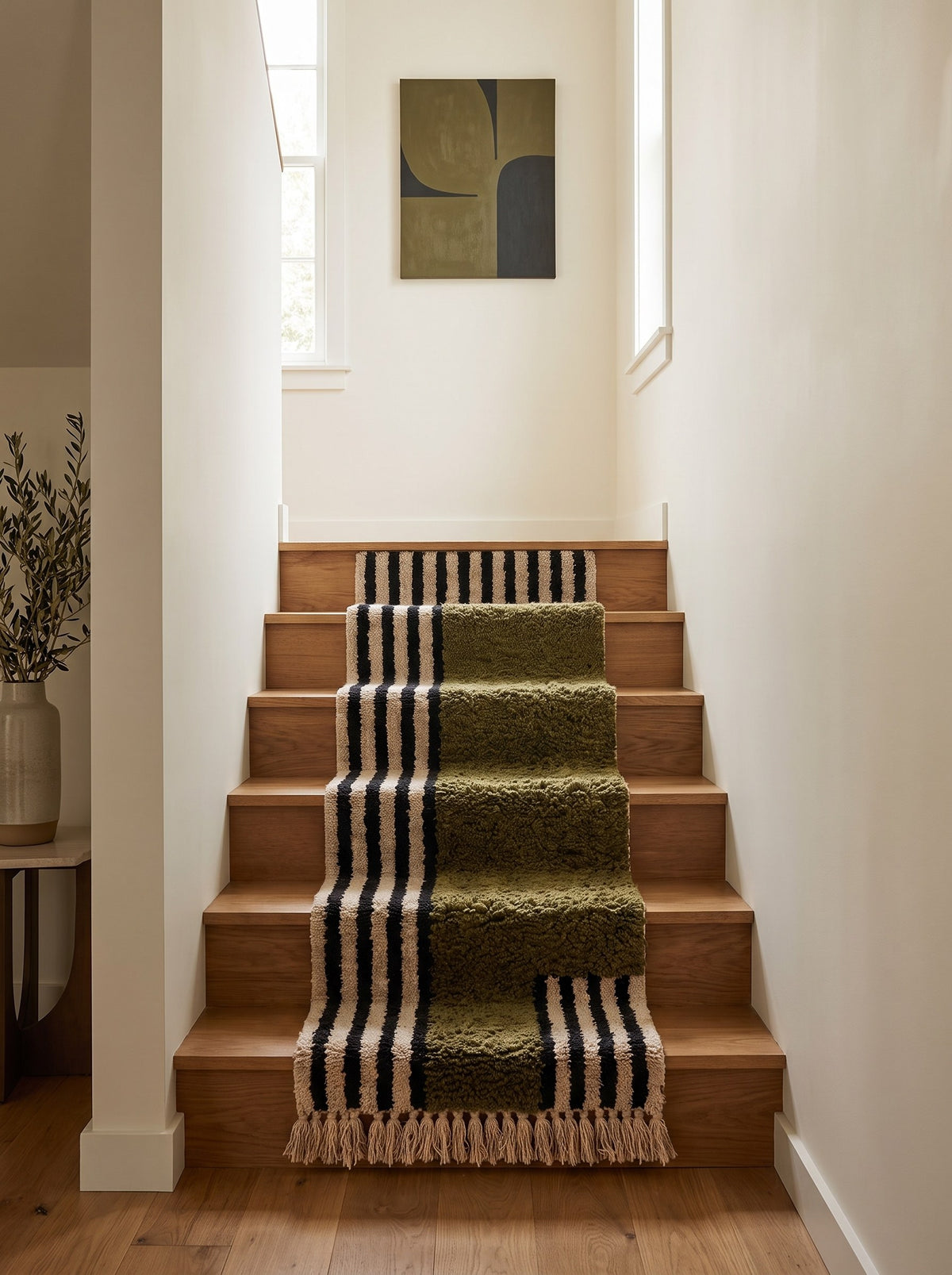 Tanuwar Berber stair runner with olive green stripes on another staircase, hand-knotted in Morocco