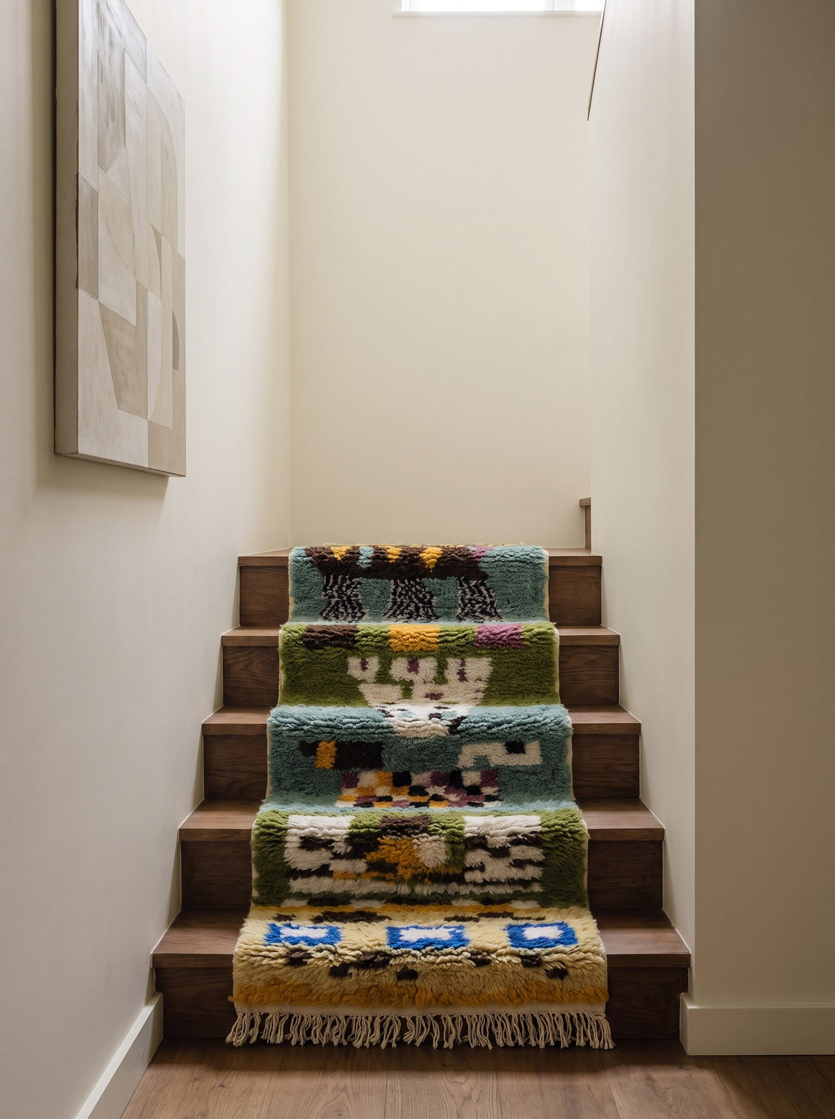 Kerdous Berber stair runner, multicoloured graphic pattern, on a staircase, hand-knotted in Morocco