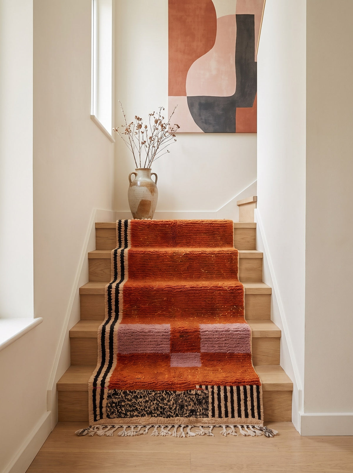 Boumalne graphic Berber stair runner in terracotta on a third staircase, hand-knotted in Morocco