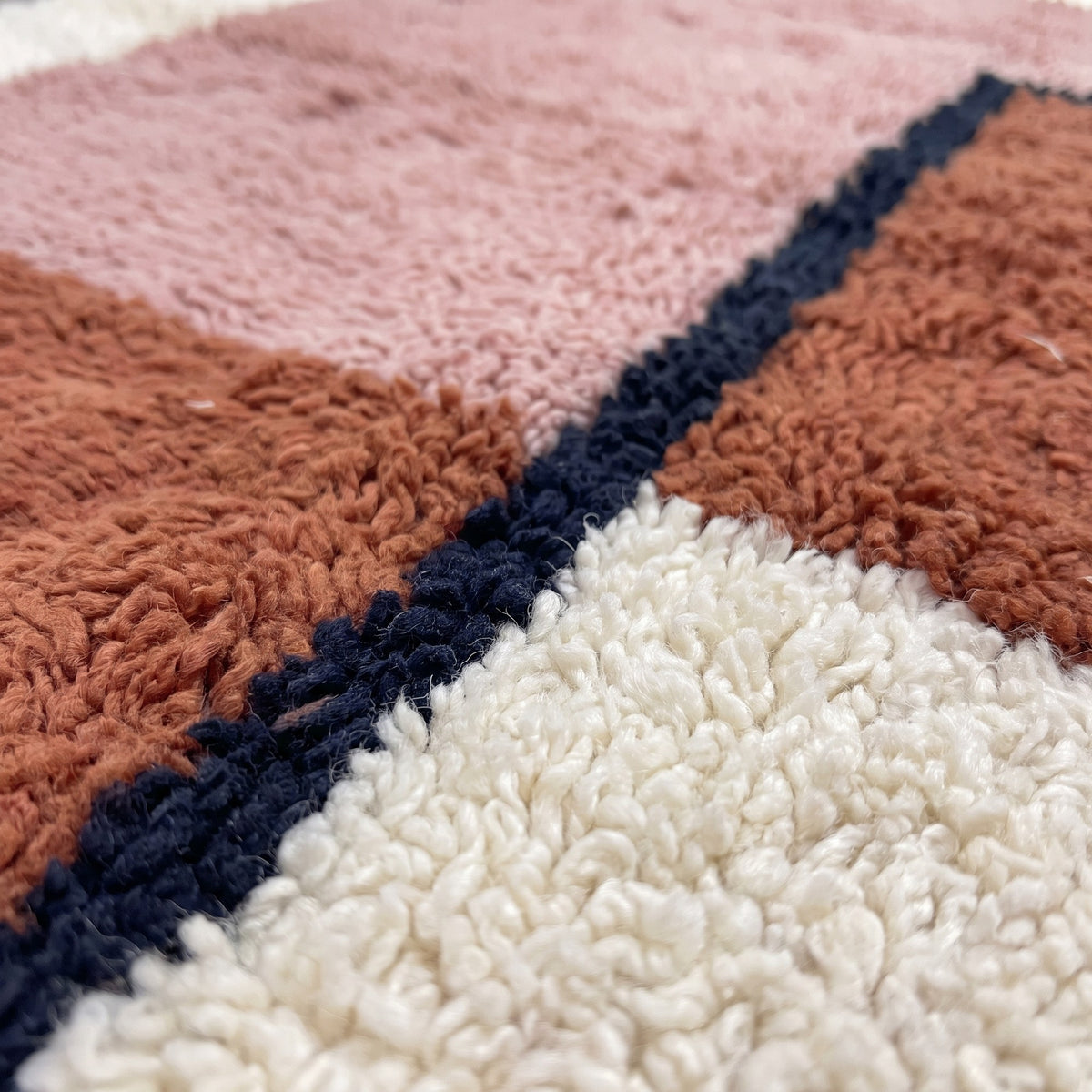 Close-up of a motif on the Dalzira Berber stair runner, long-pile ecru runner with a wide margin