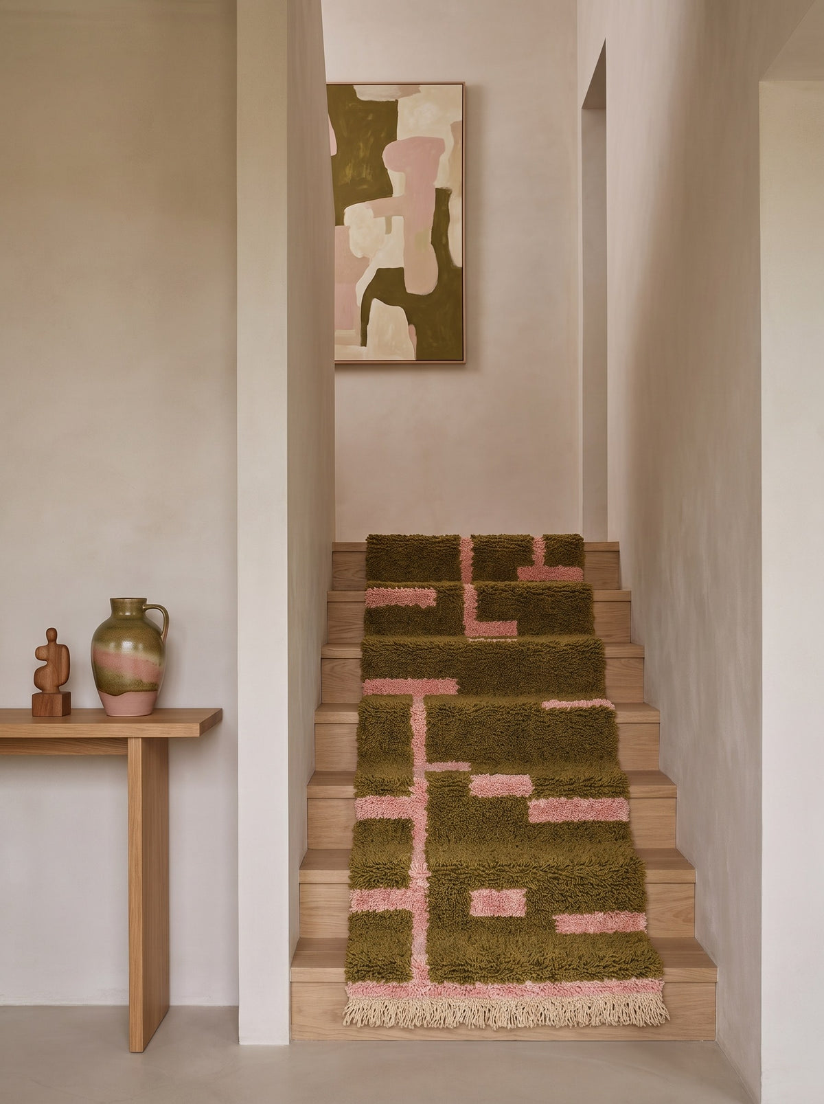 Bougmez graphic Berber stair runner in olive green and pink on a staircase, hand-knotted in Morocco