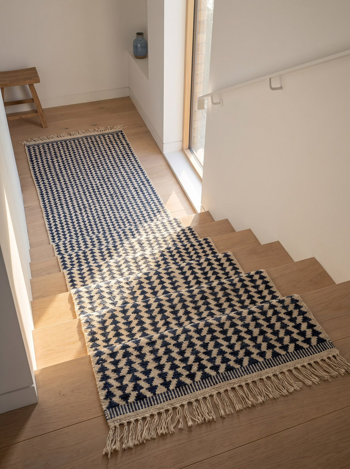 Tamsoult kilim Berber stair runner in white and blue on a third staircase, hand-knotted in Morocco