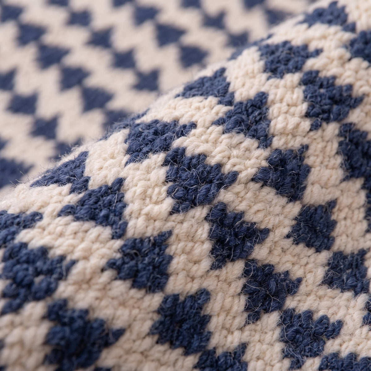 Close-up of a motif on the Tamsoult Berber stair runner, tight short pile on an ivory field