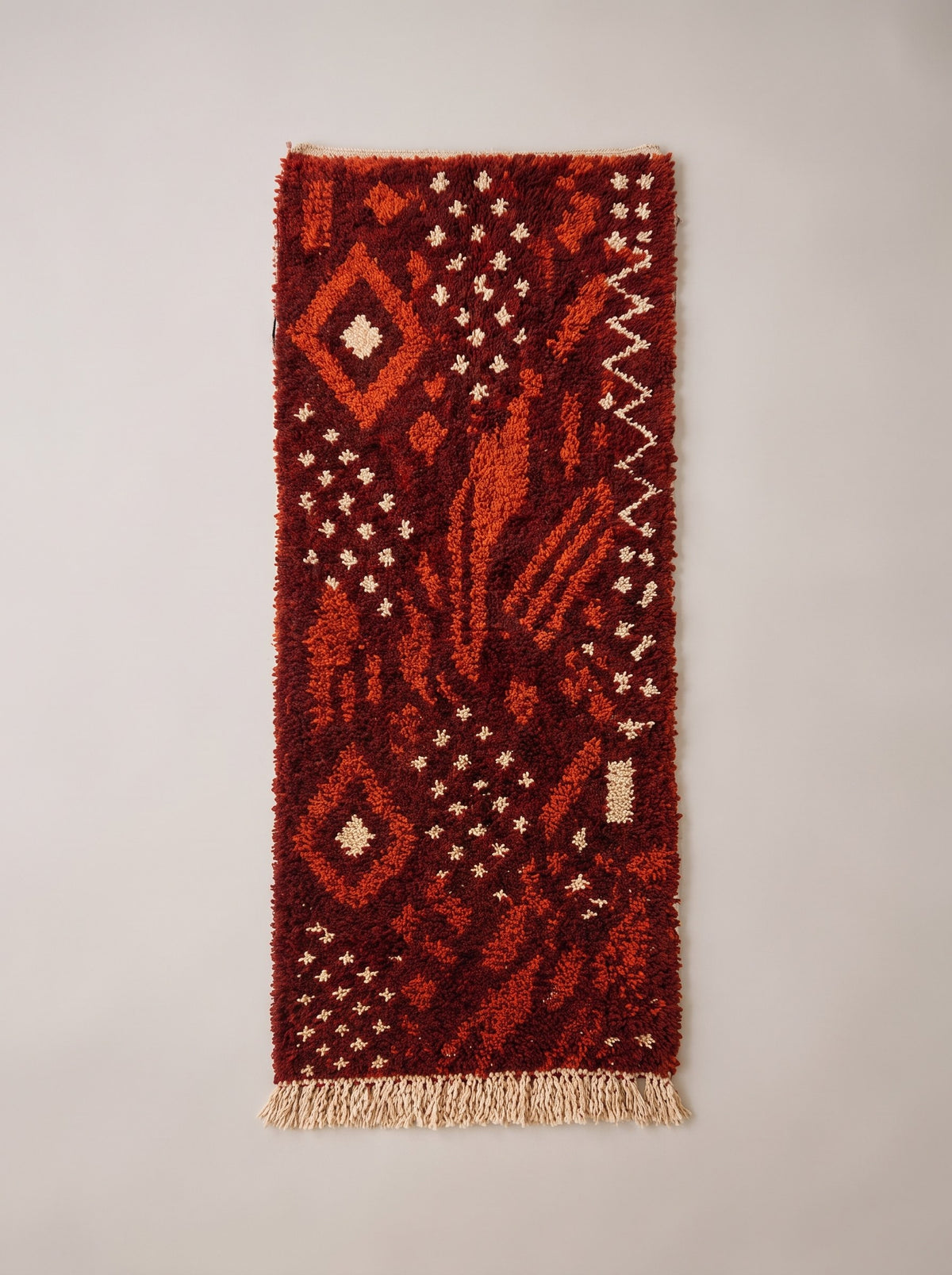 Khenifra Berber stair runner, Boujad style, in burgundy, laid flat, burgundy runner, an orange diamond at the top left