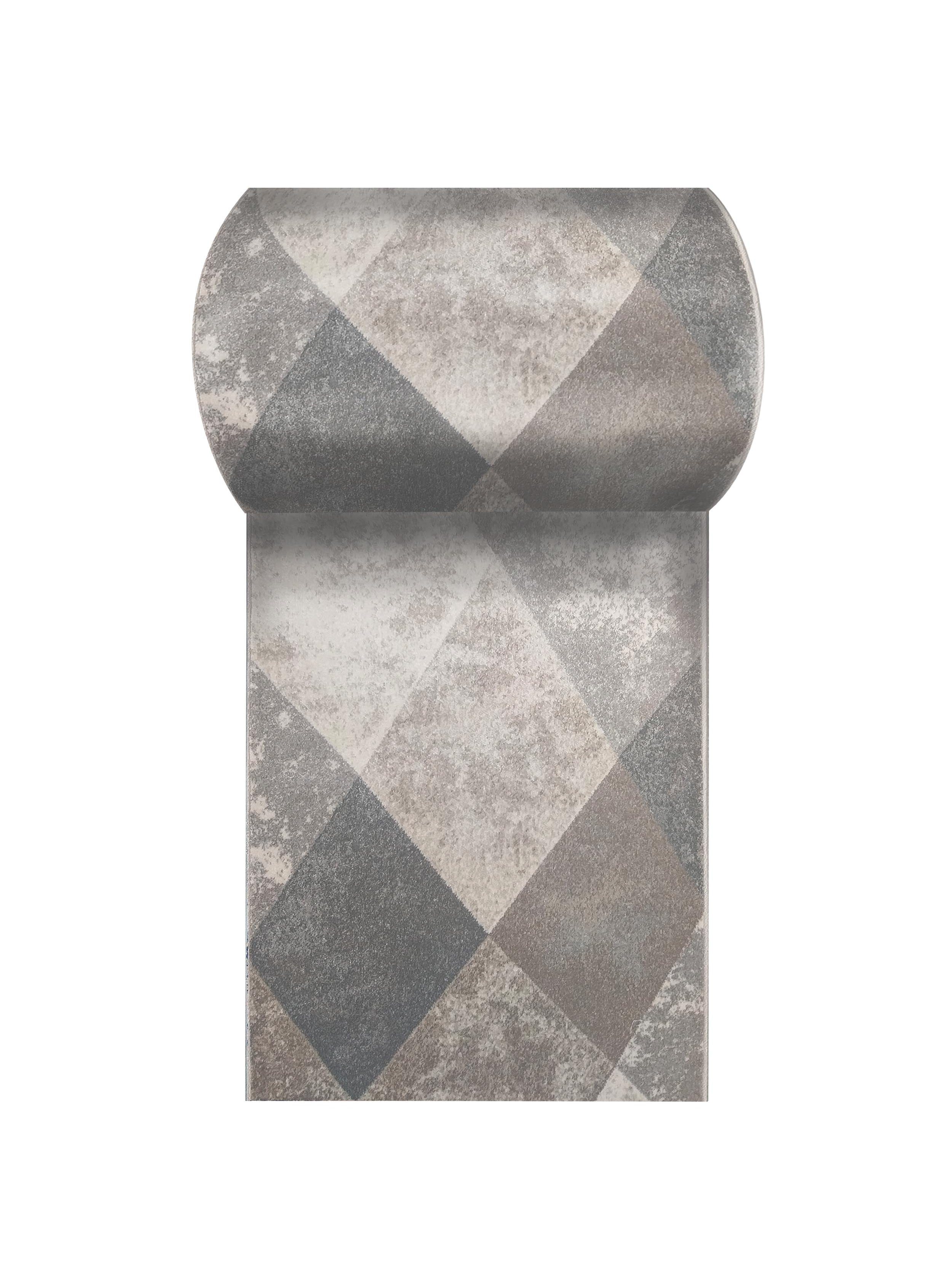 Tapis enroulé à motifs de losanges gris et beiges, avec une texture textile chinée visible